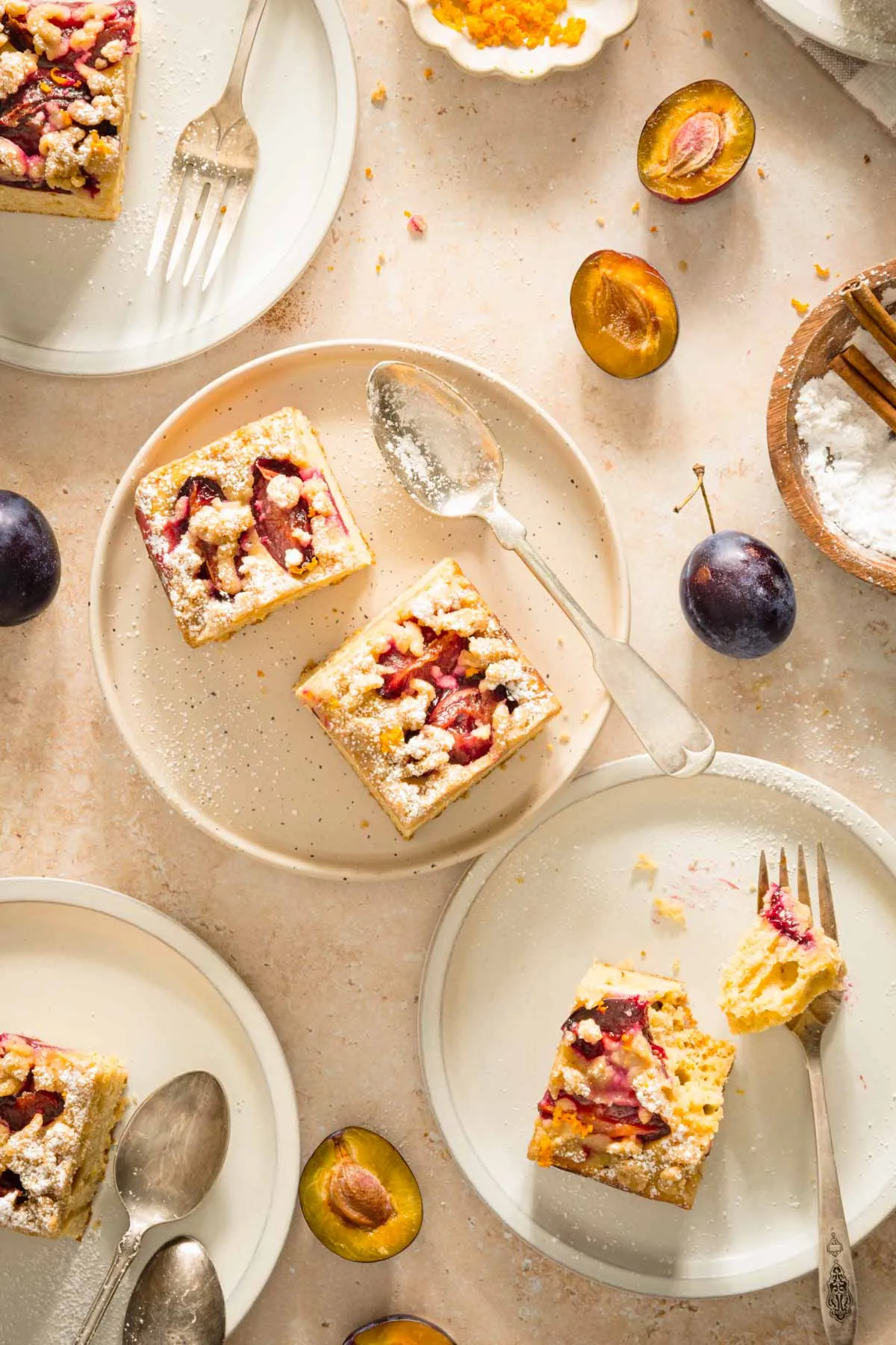 polish plum cake cut and arranged on various plates