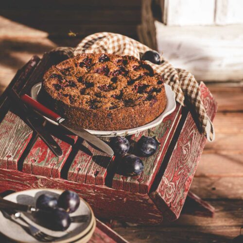 plum cake on a wooden chair