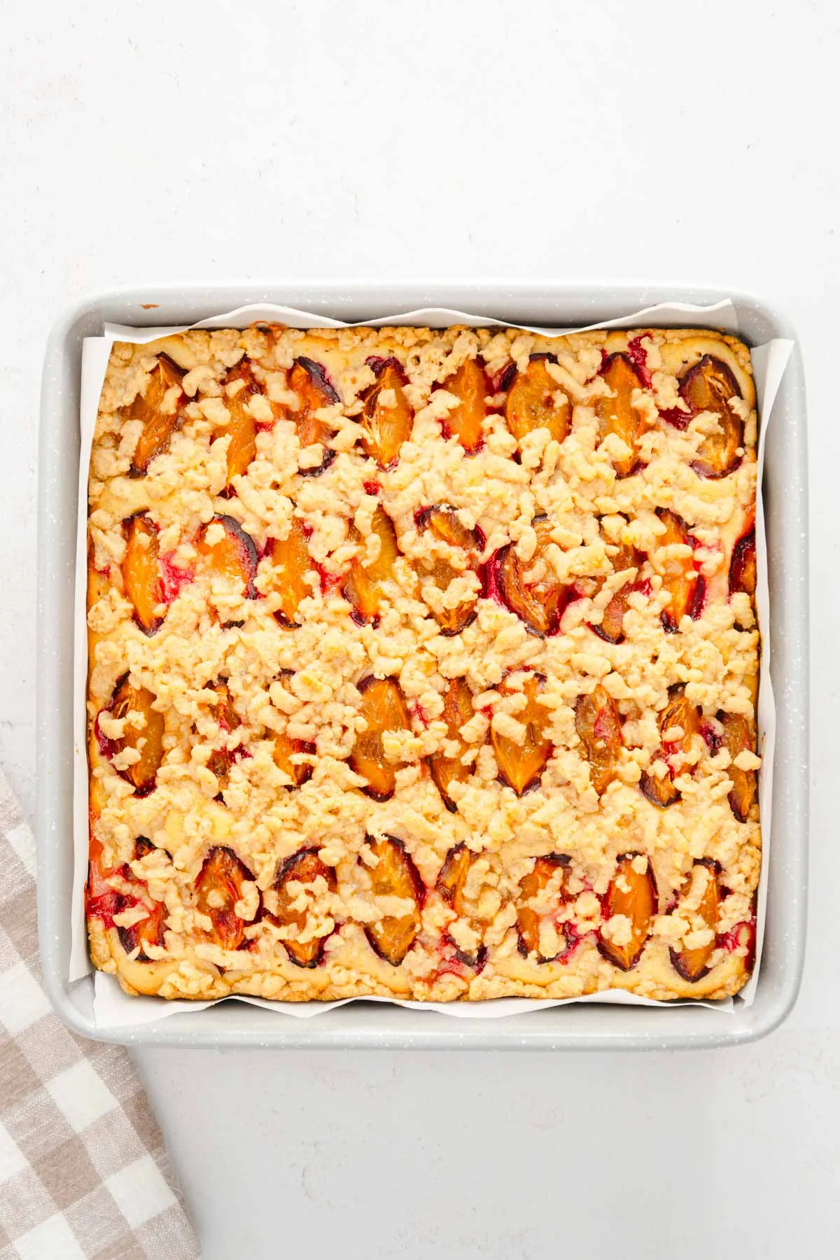 baked polish plum cake in a baking dish