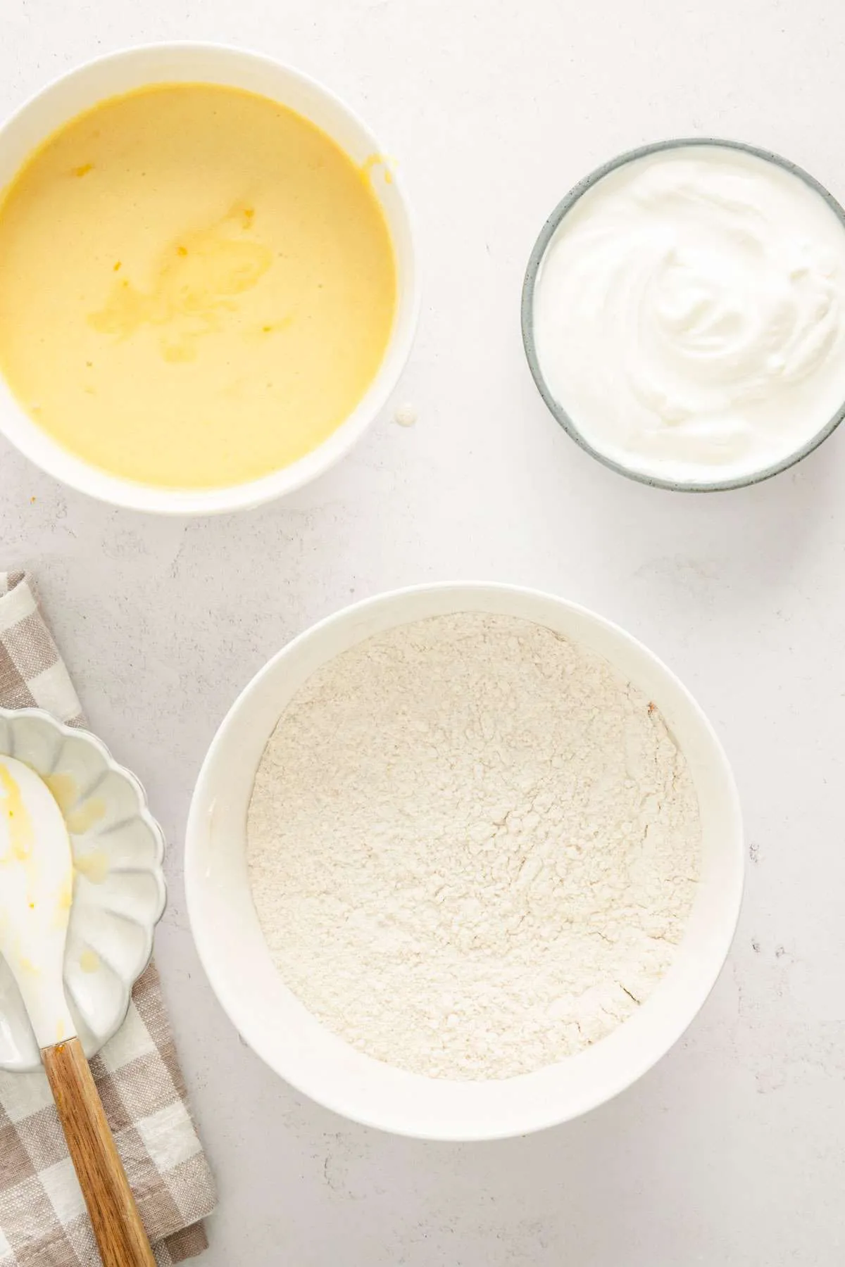 bowl with flour mix, one with egg mixture and one with cream