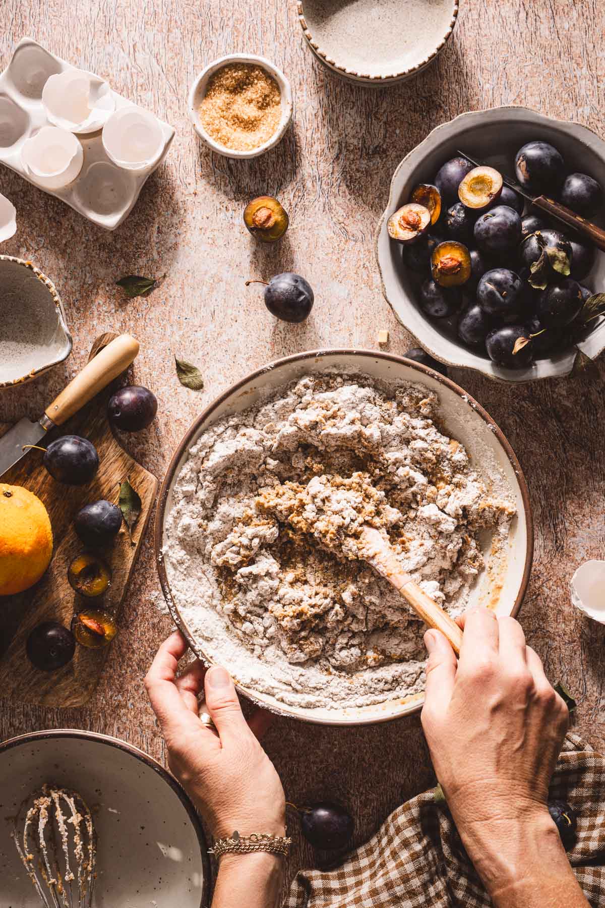 hands in frame mixing the batter