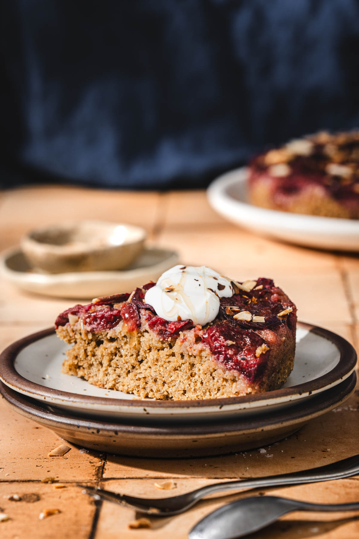 slice of cake with cream on top