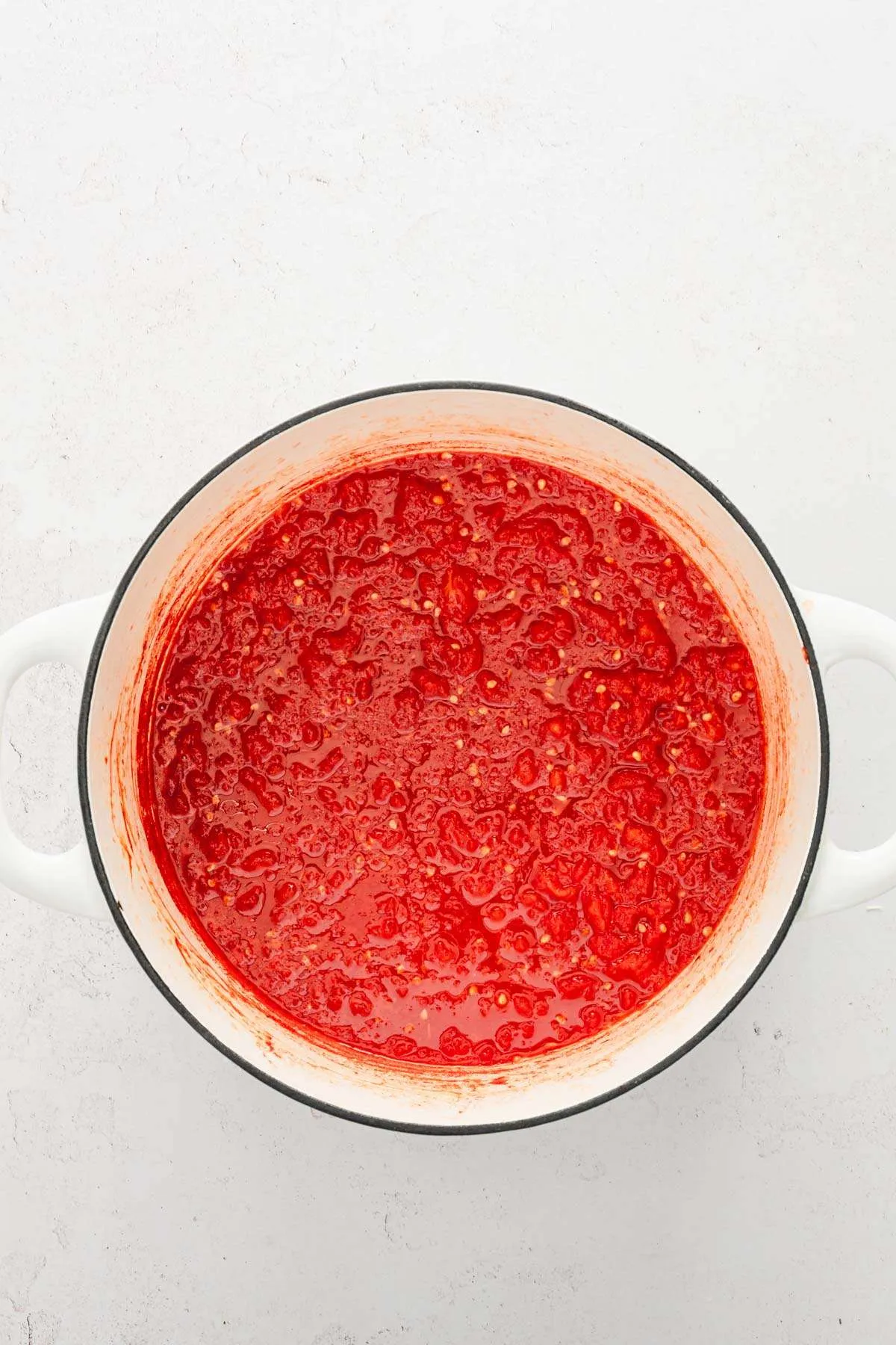 large stock pot with cooked down tomatoes