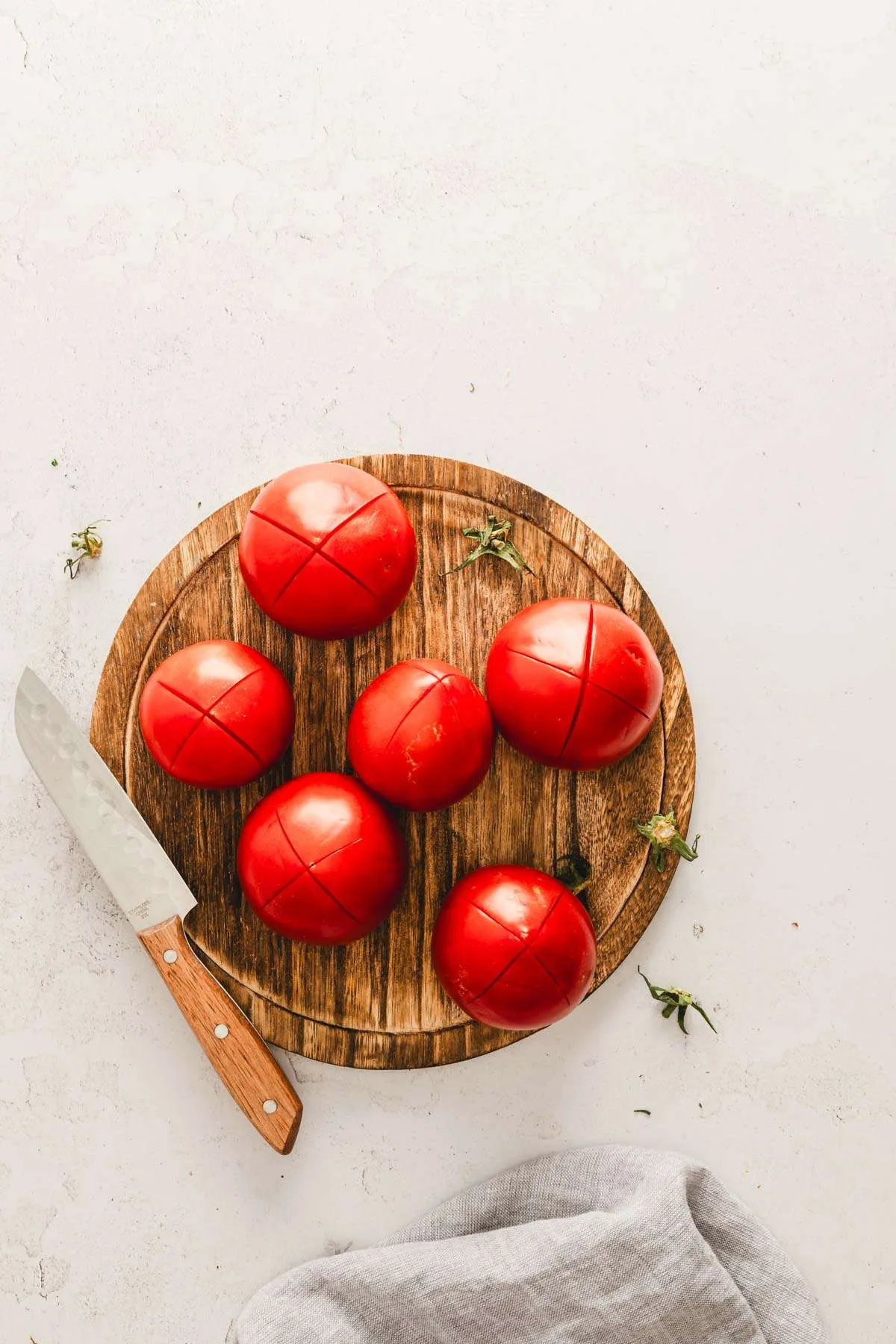 fresh tomatoes with their bottoms cut across