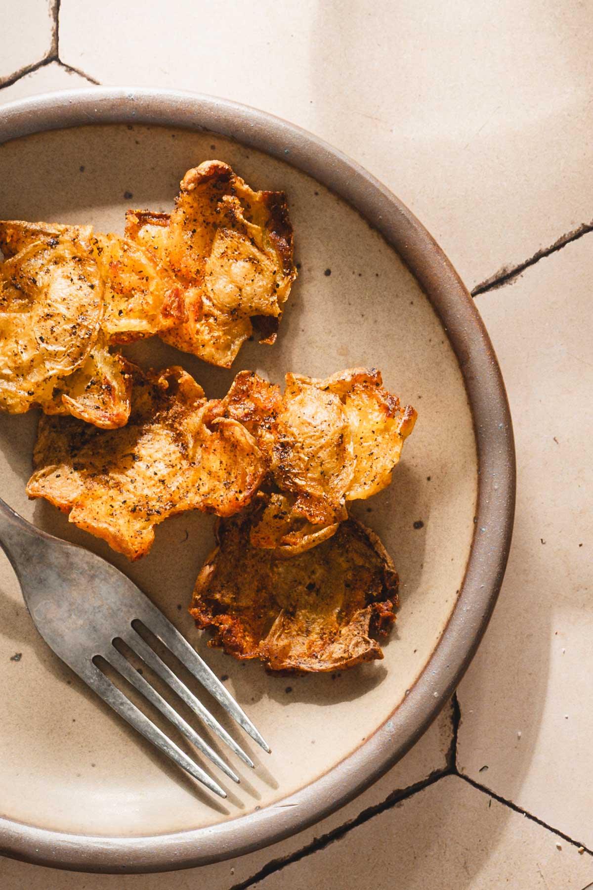 close up of a plate with crispy potatoes