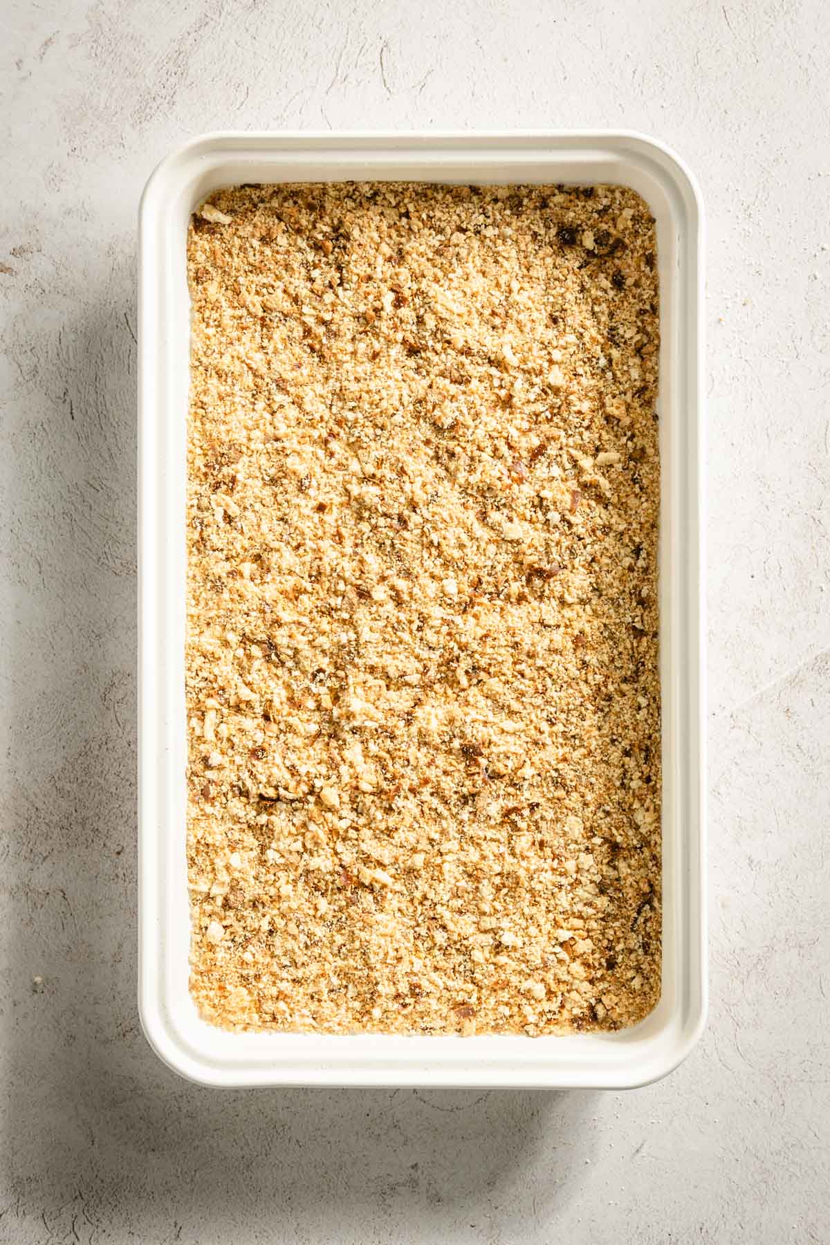 pretzel crumbs on a baking sheet