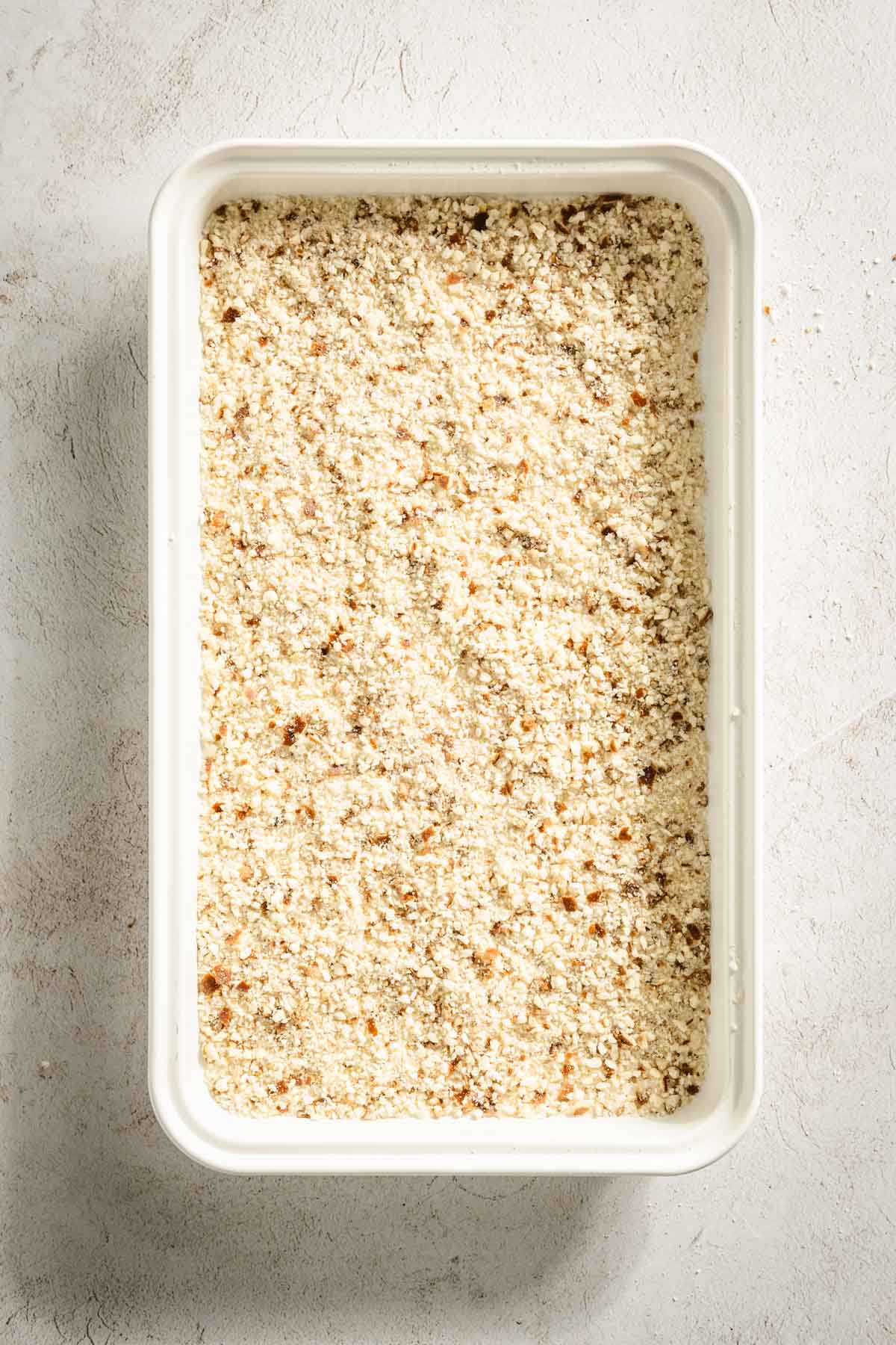 pretzel crumbs on a baking sheet, before baking