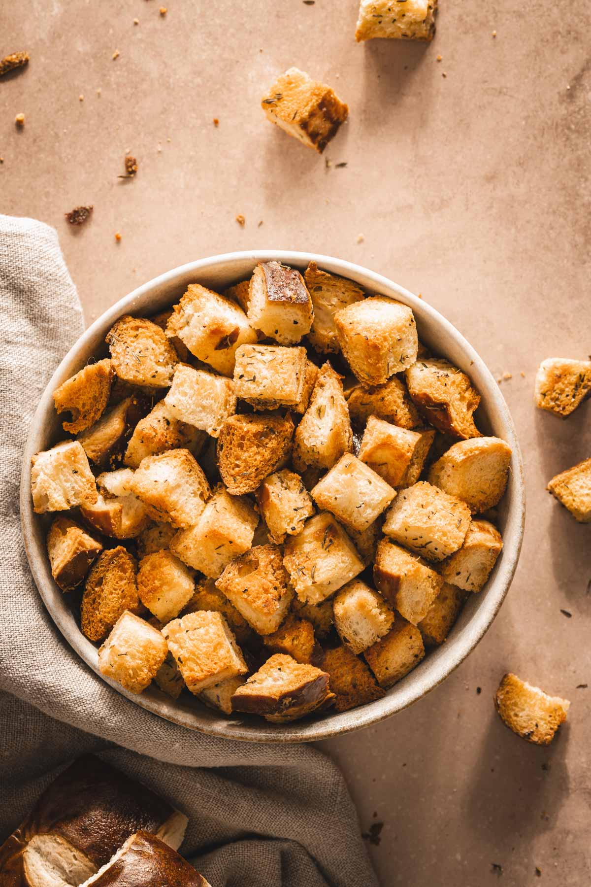 pretzel bun croutons in a serving bowl , close up