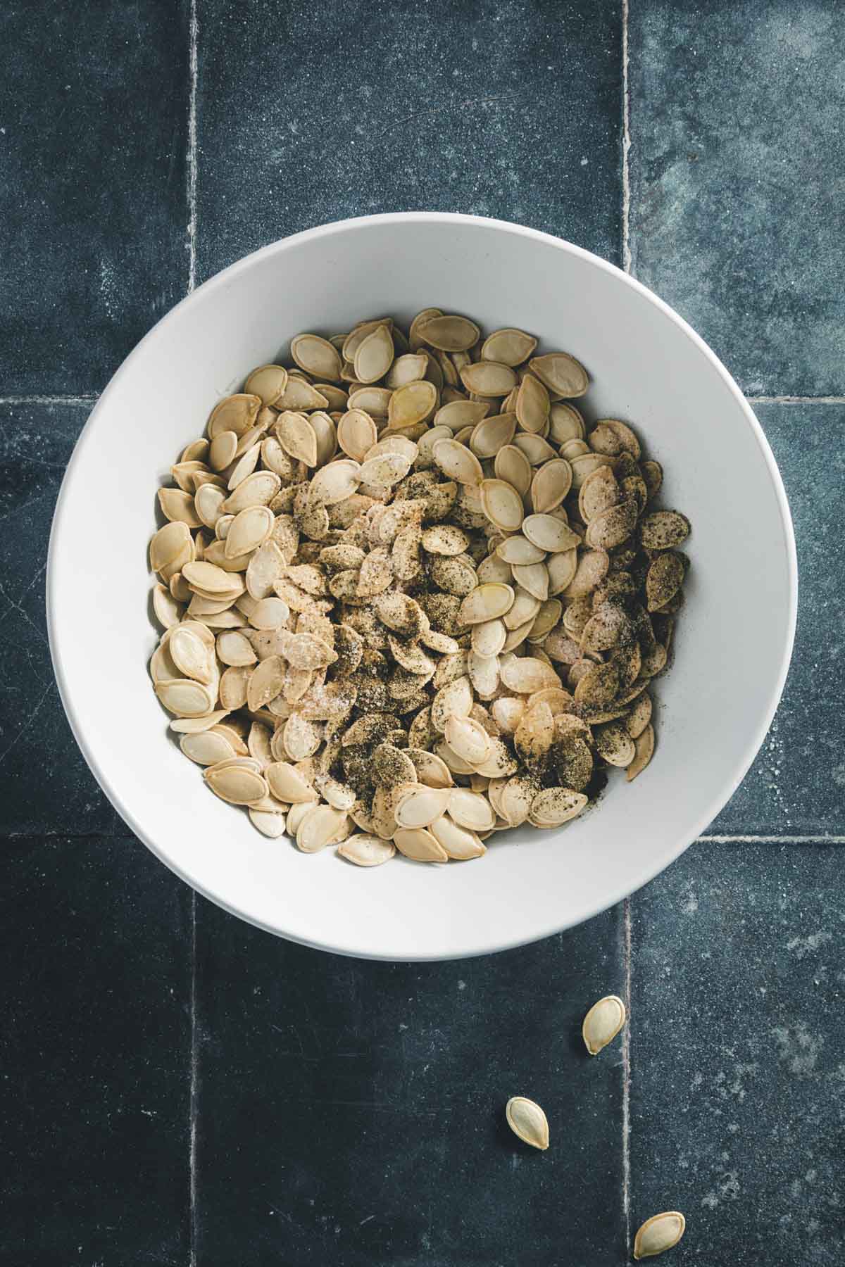 pumpkin seeds mixed with oil and spices