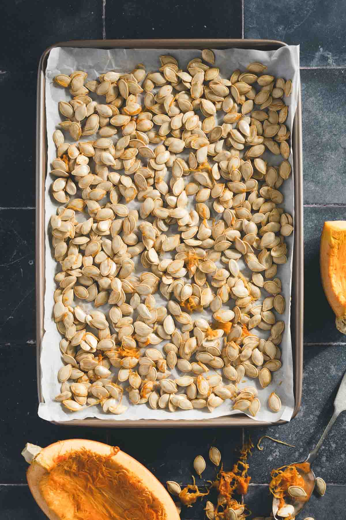 pumpkin seeds on a baking sheet