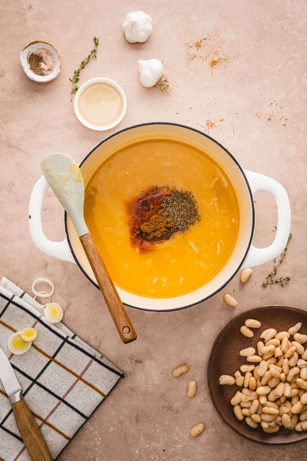 soup pan with pumpkin puree and leeks and added broth, spices