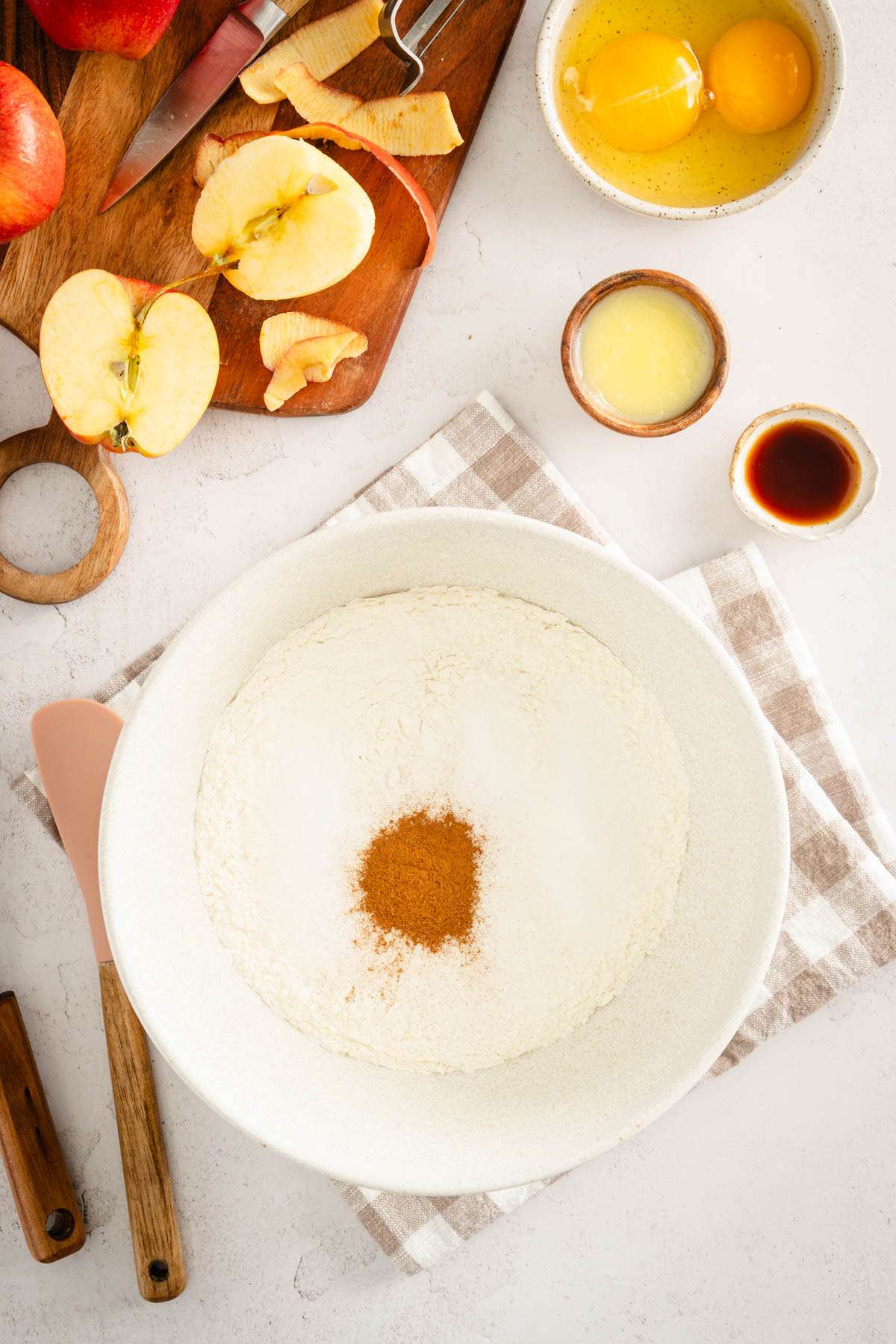 bowl with flour, cinnamon added to the bowl