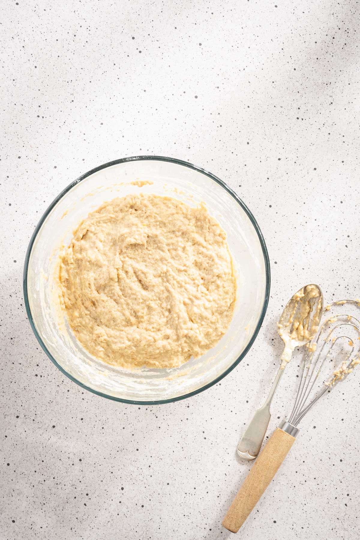 ingredients for Racuchy mixed in a glass bowl