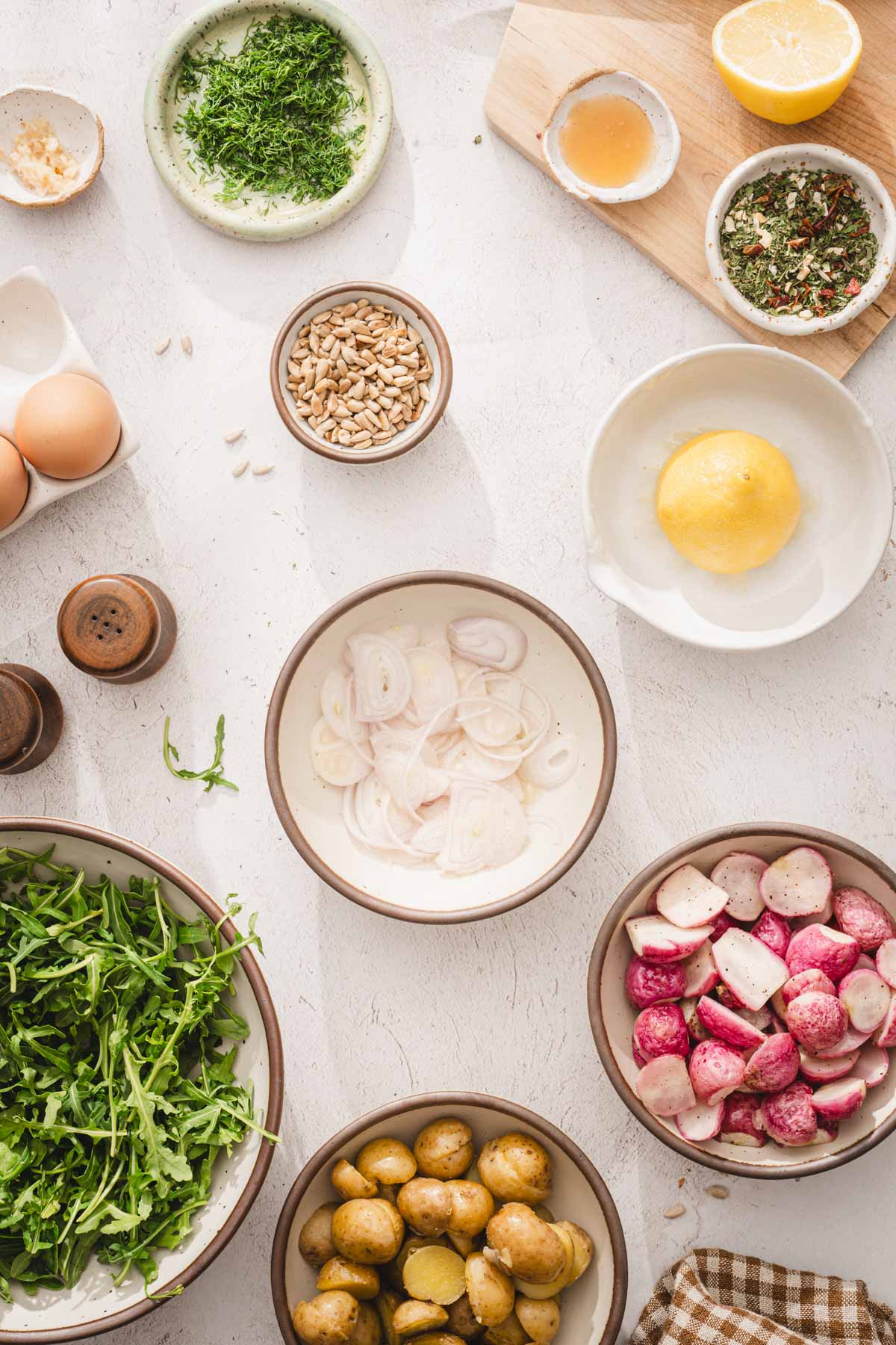 small bowl with sliced shallots dipped in lemon juice