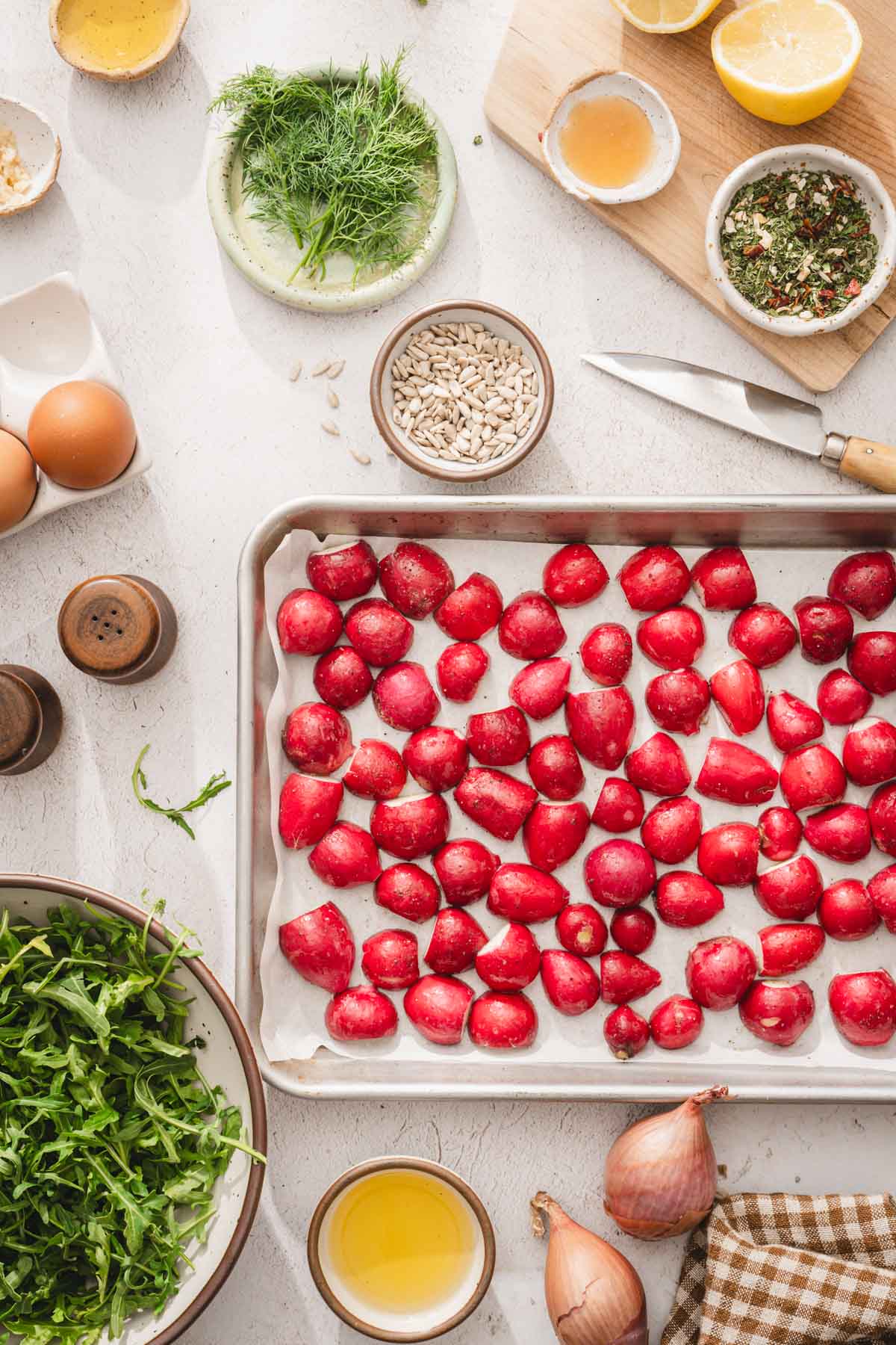 halvedradishes on a baking sheet
