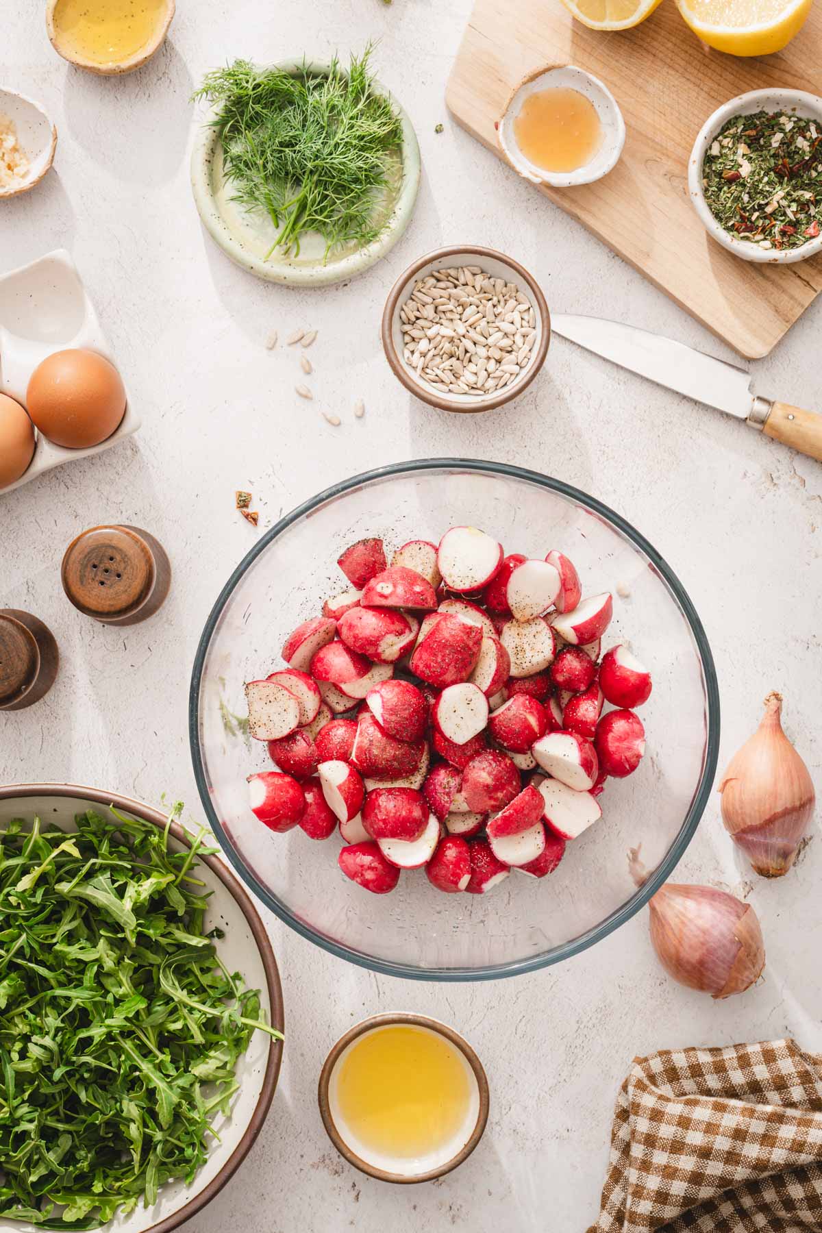 halved radishes in a glass bowl
