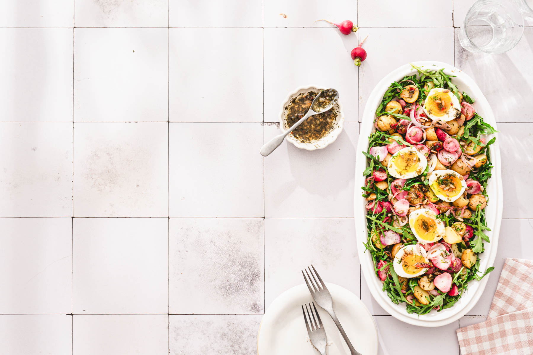serving platter, plates, forks,glass with water