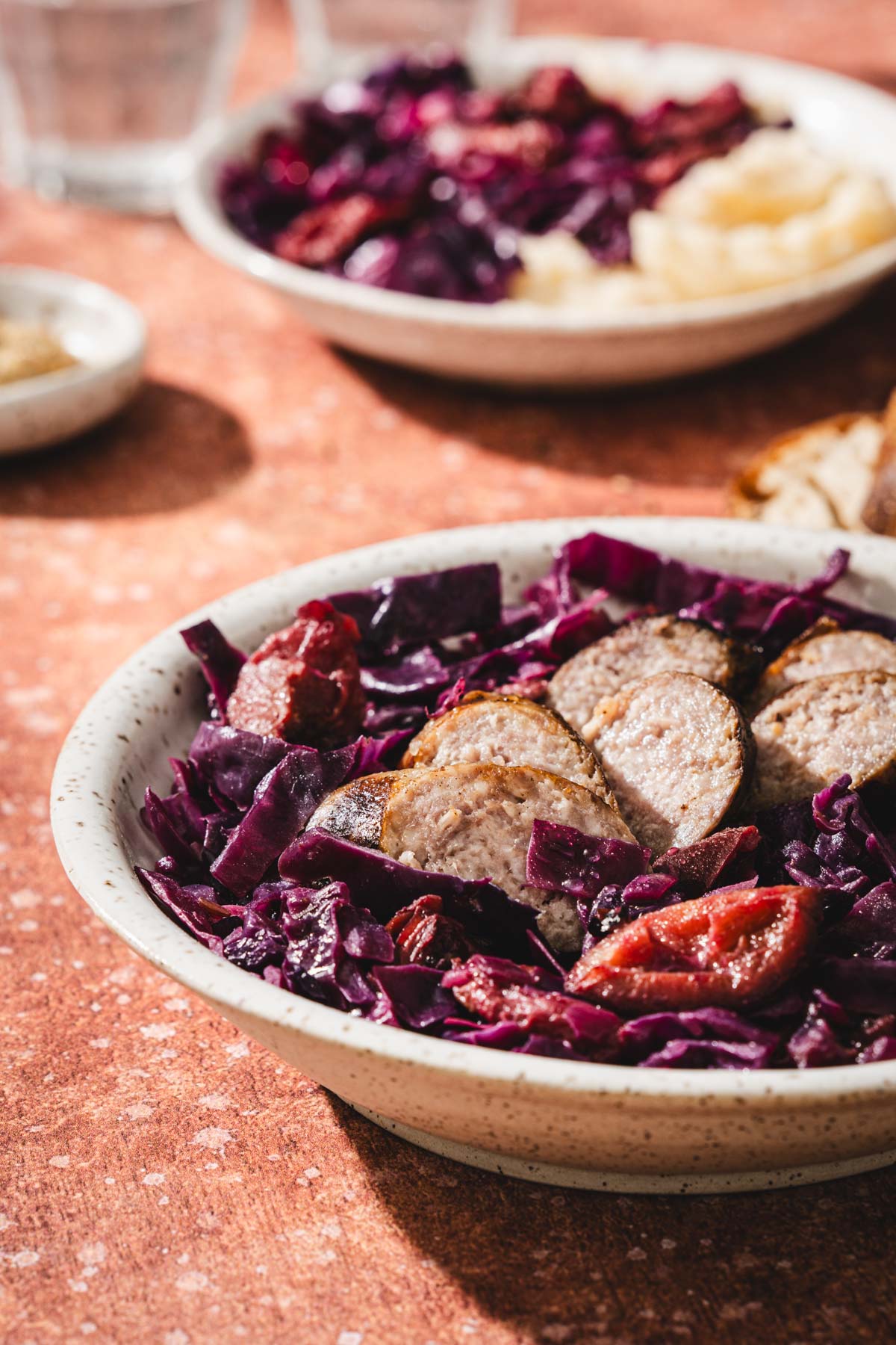 side view of a dish with cabbage and sausage