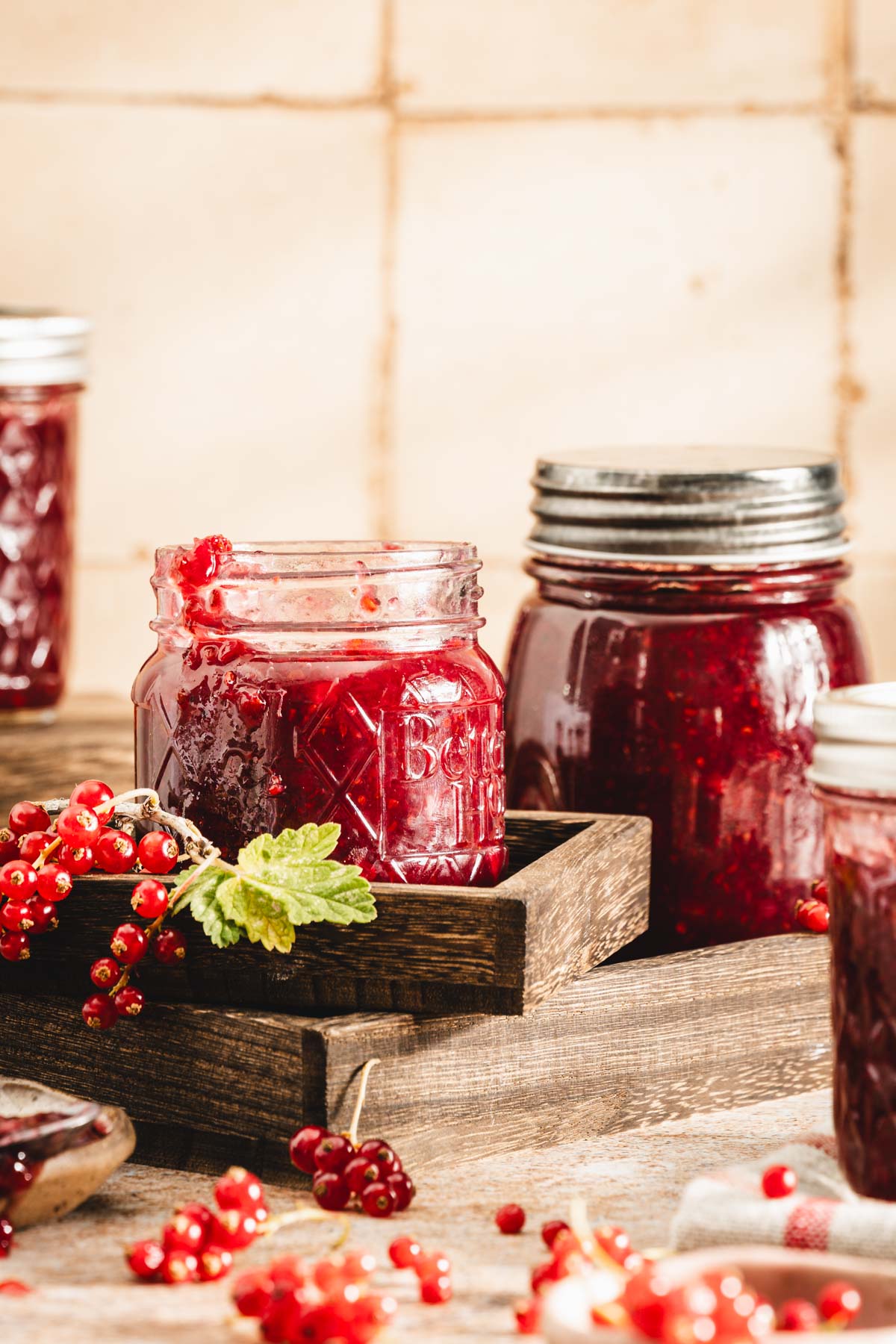 close up of a jar with red currant jam