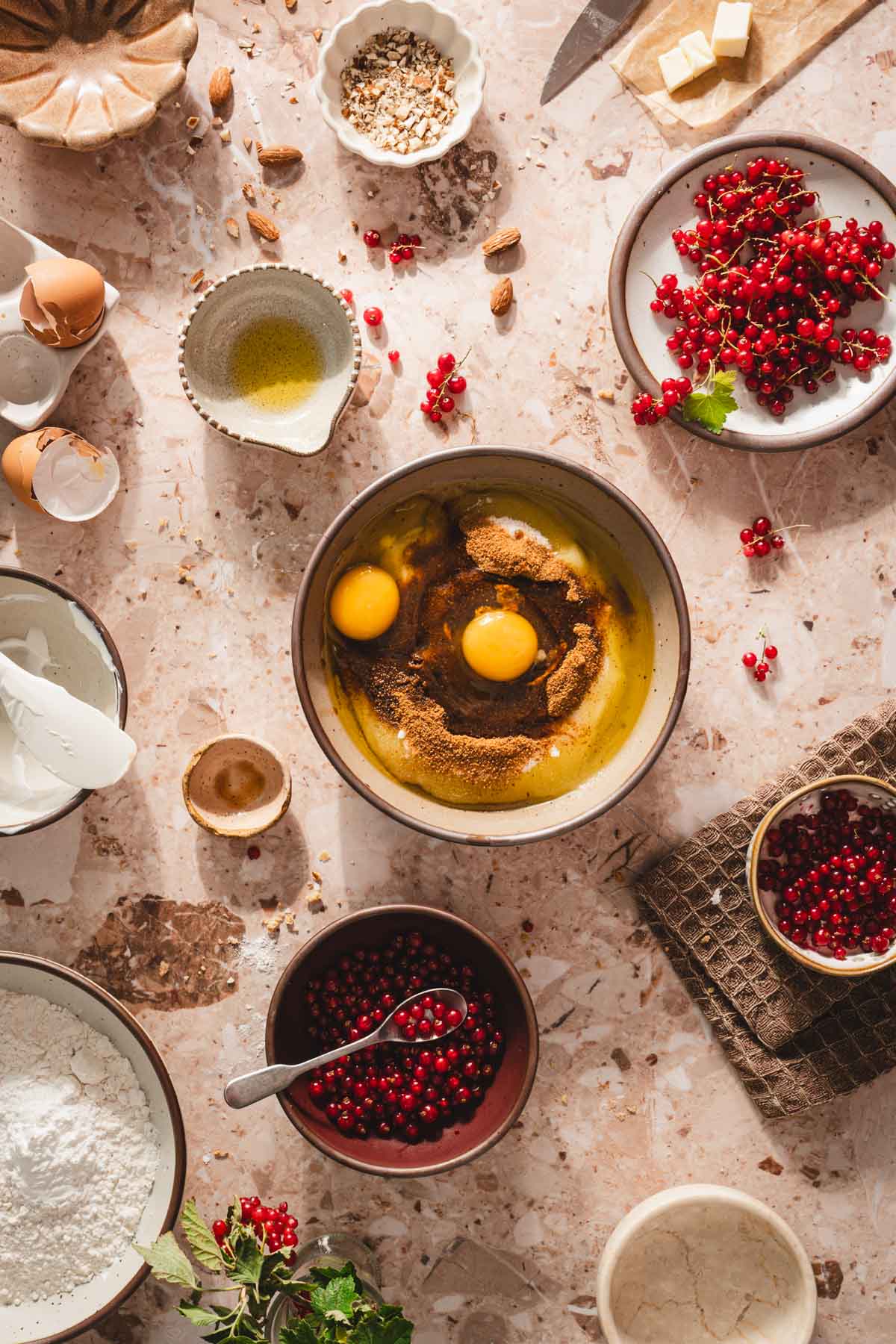 eggs, sugar added to the bowl with yogurt