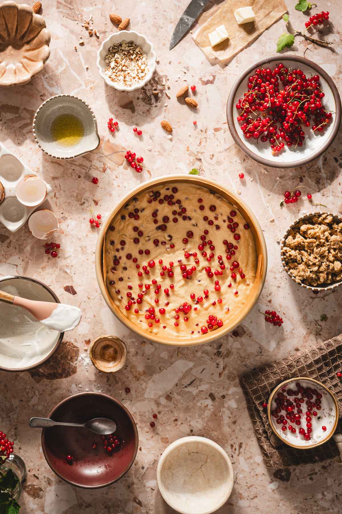 batter in a baking pan with berries on top