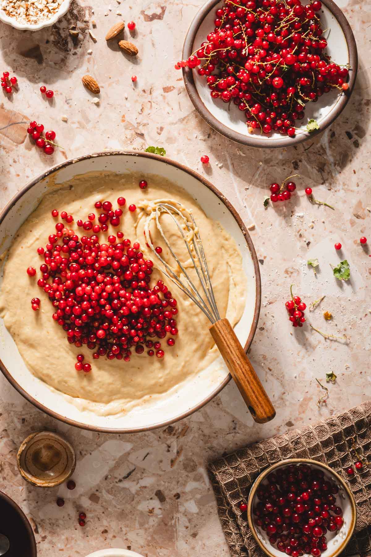 bowl with the cake batter and berries added on top
