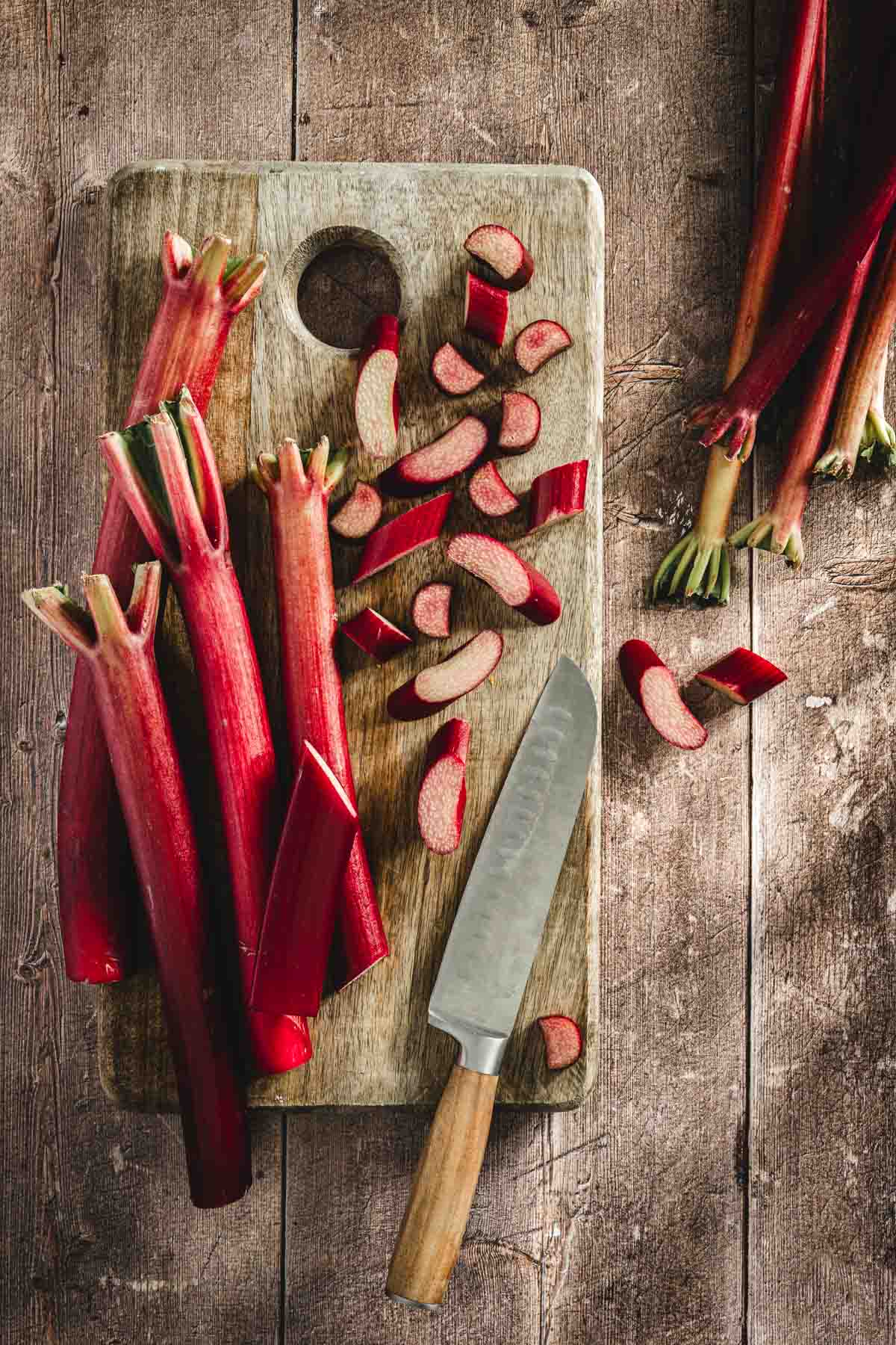 rhubarb stalks on a cutting board, knife