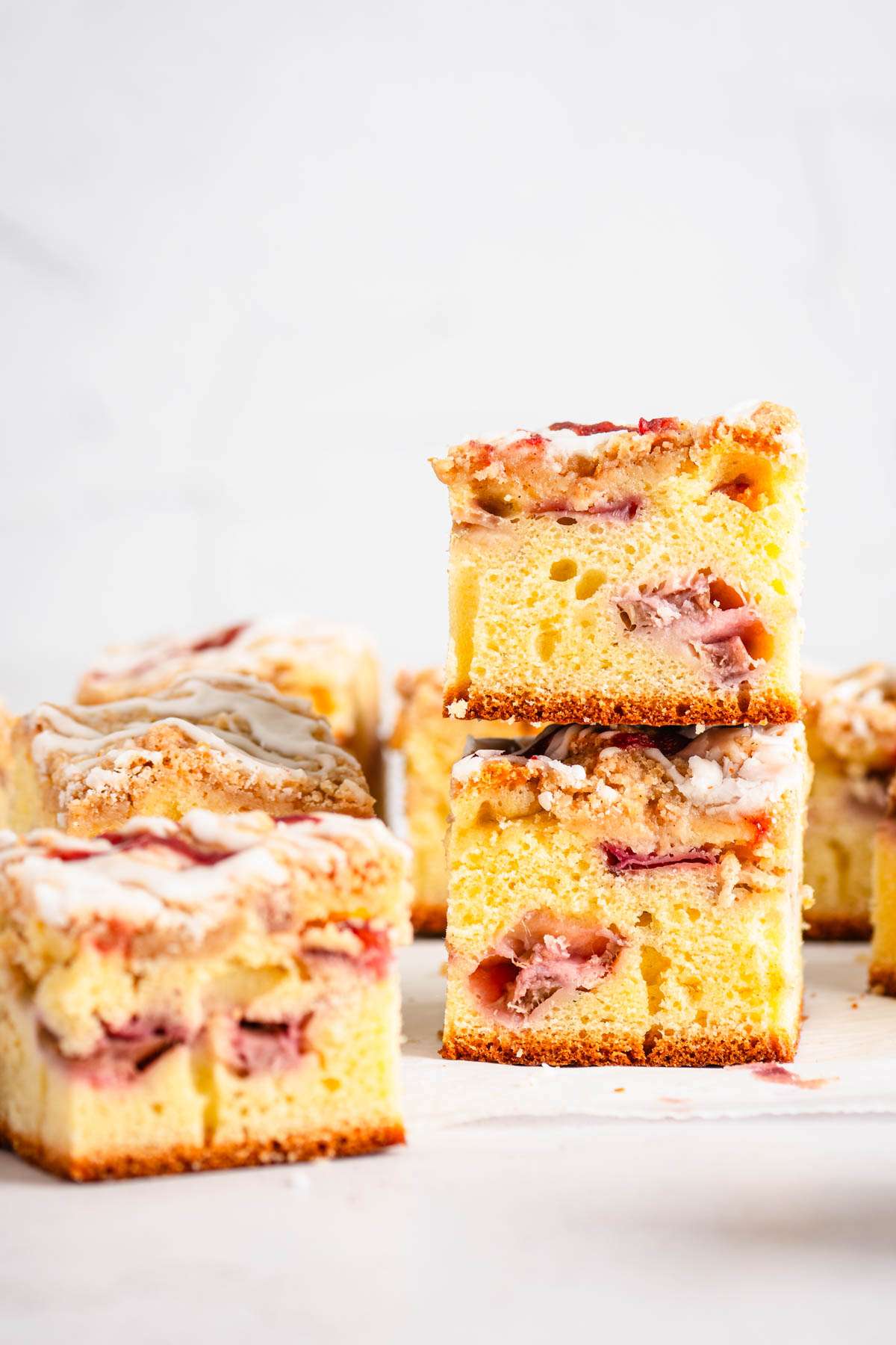 front view of rhubarb cake, slices stacked up