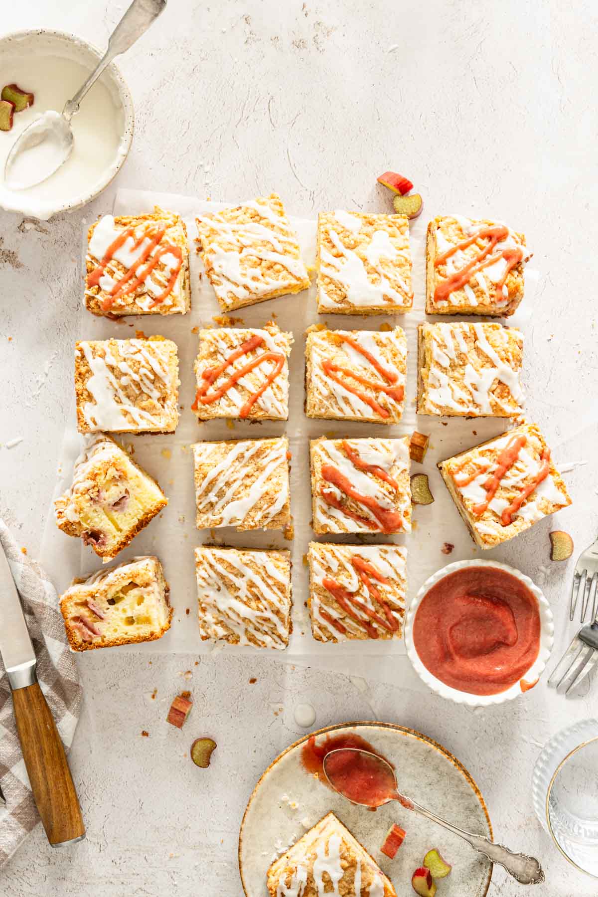 cut up baked rhubarb cake, dish with rhubarb butter