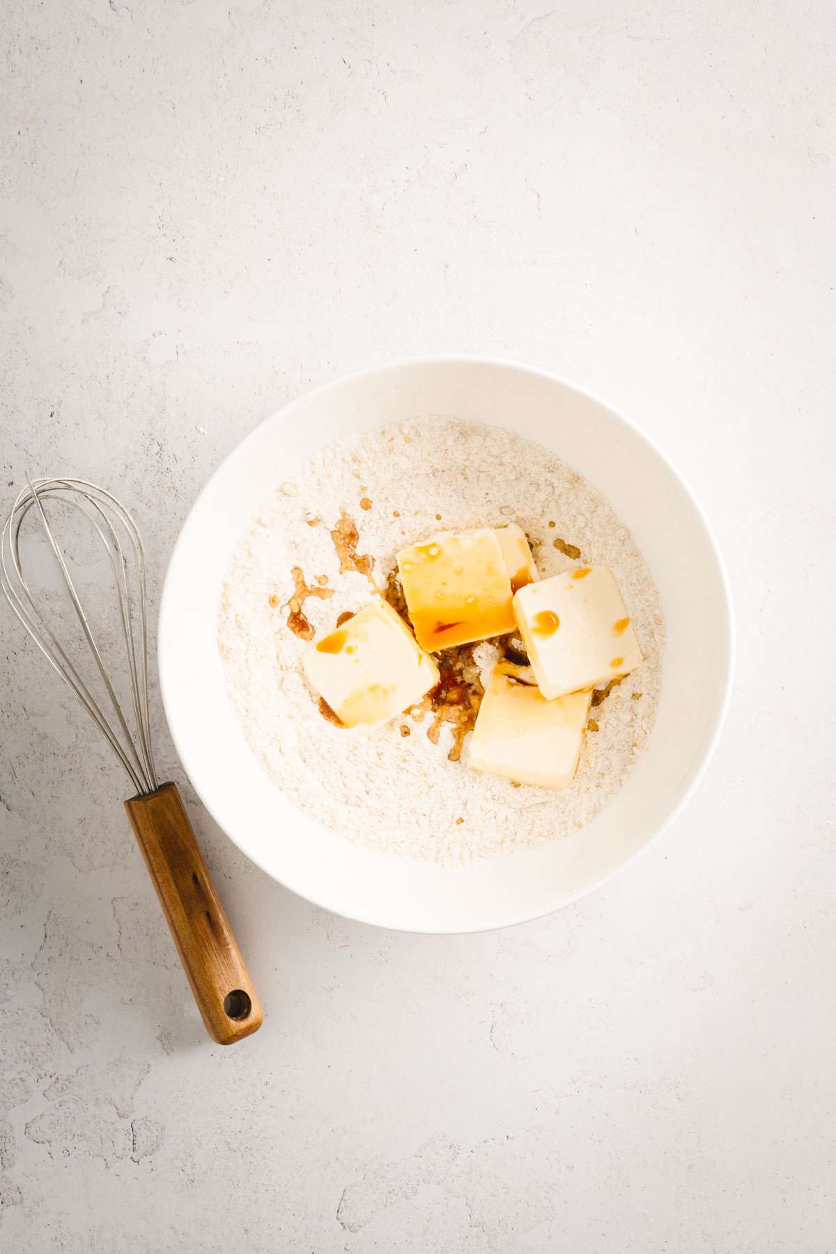 bowl with sugar, flour, cut up butter, and vanilla