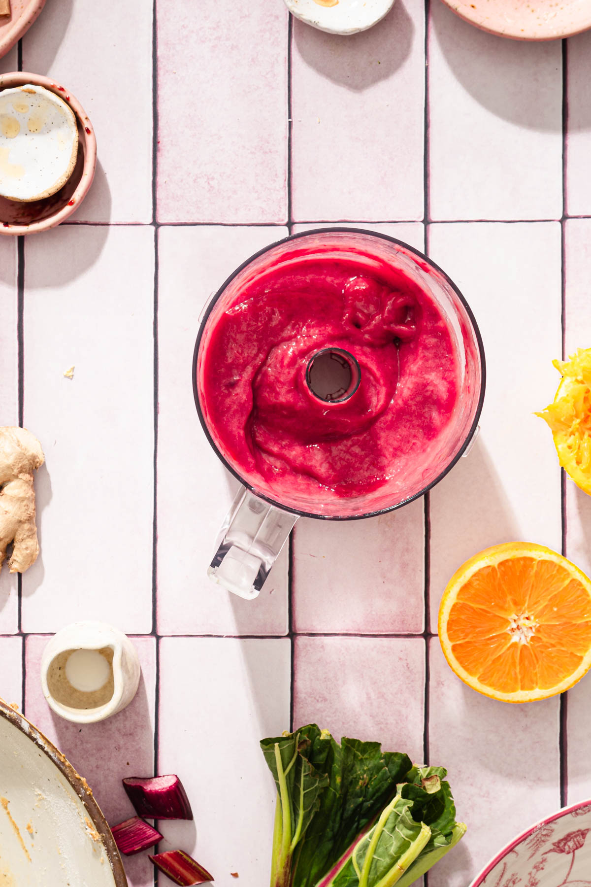bowl of food processor with rhubarb glaze mixed