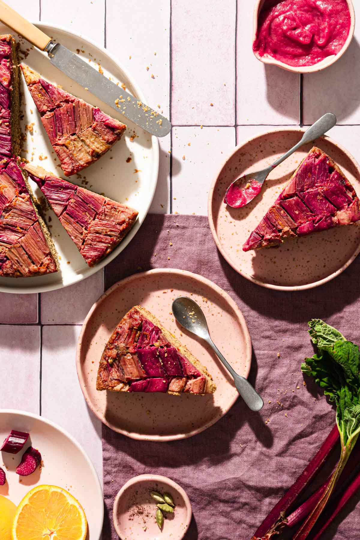 various serving plates with rhubarb cake