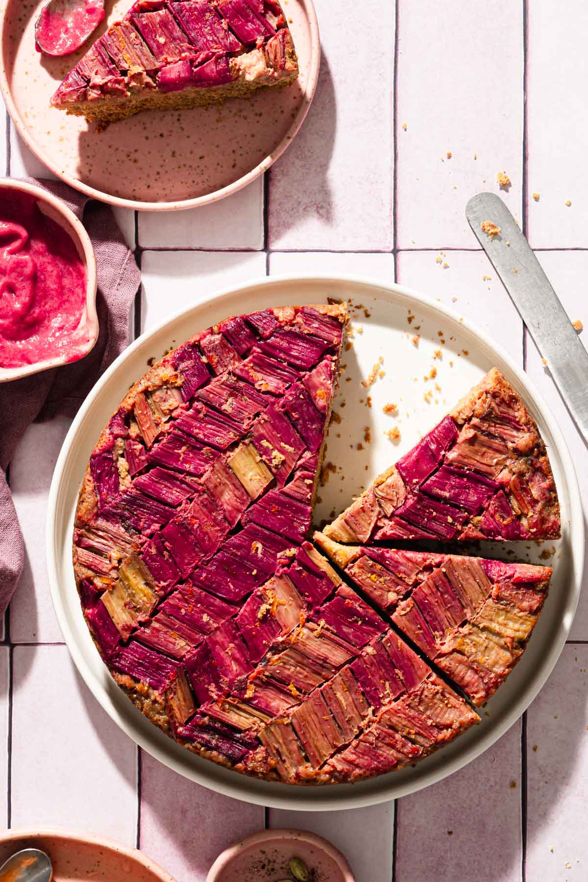 rhubarb cake in a plate, other plates around