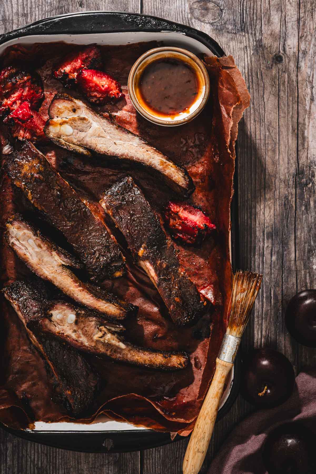 smoked, cut up ribs on a serving tray