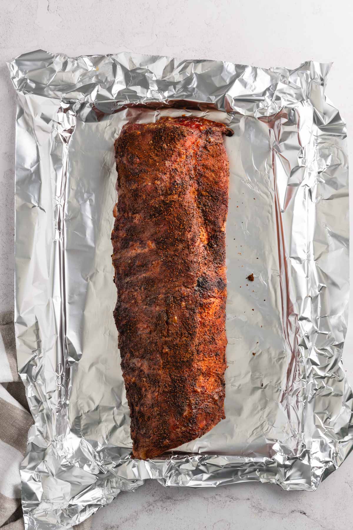 Smoked pork ribs on a foil