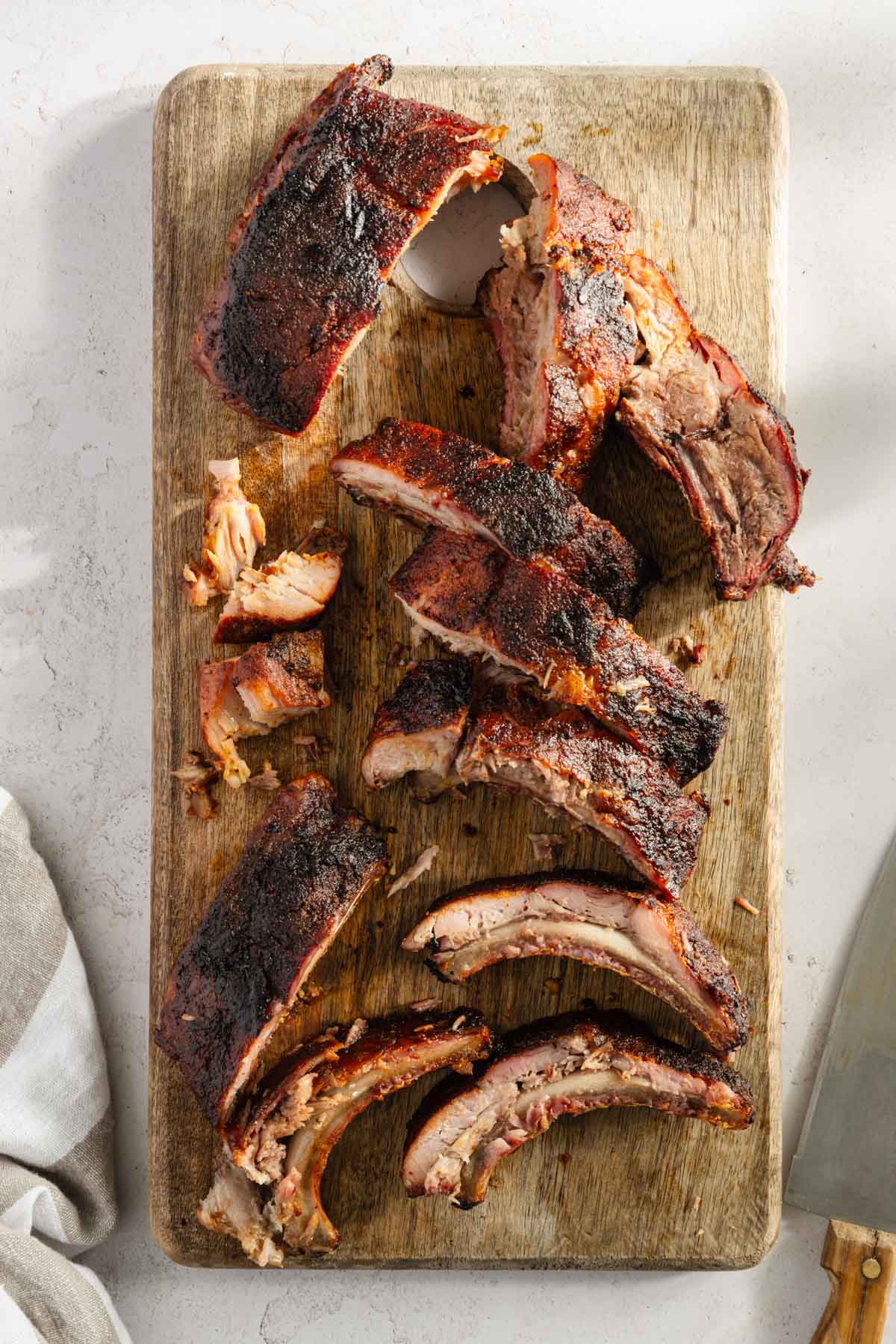 smoked cut up ribs on a cutting board