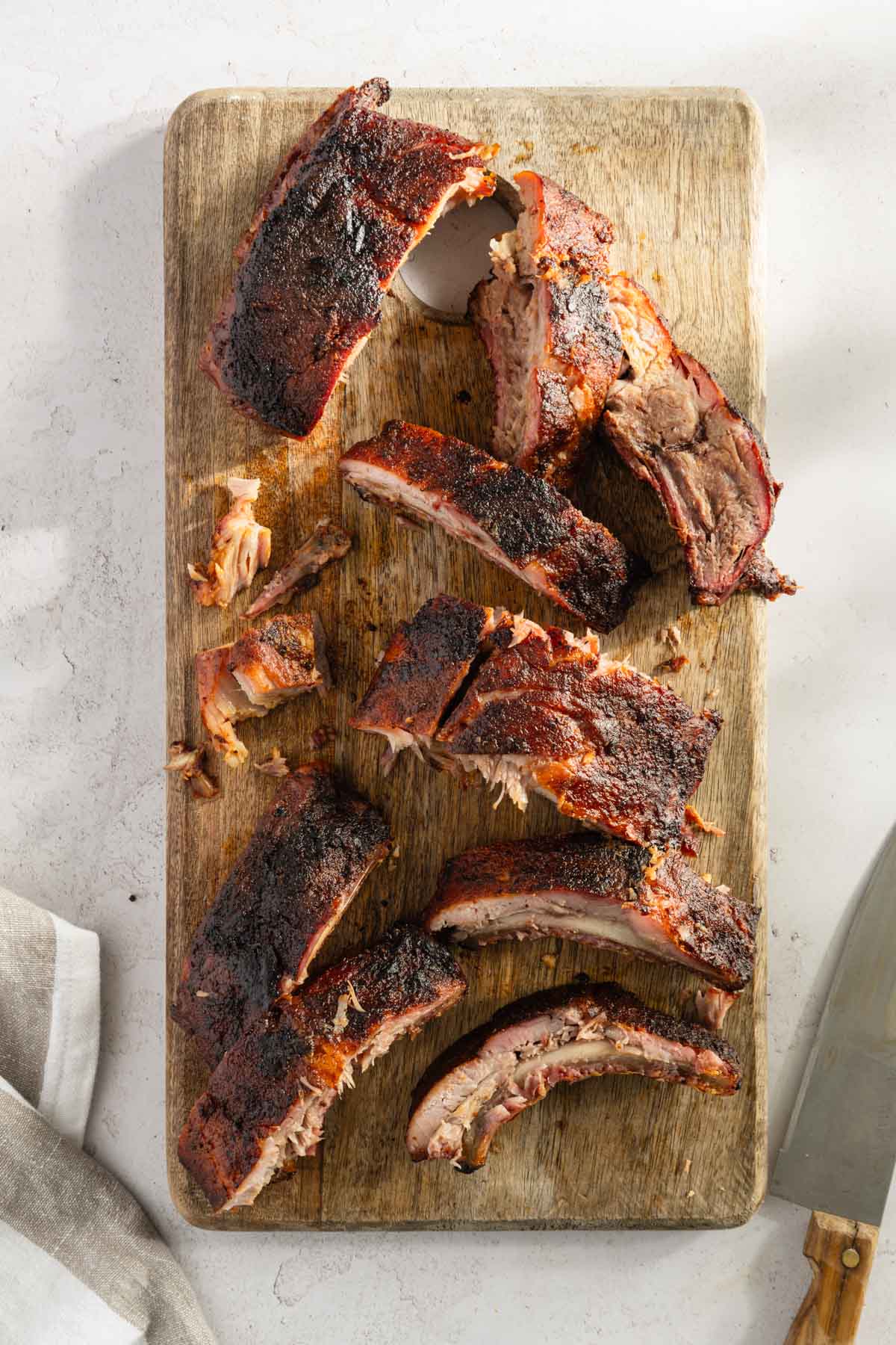 smoked cut up ribs on a cutting board