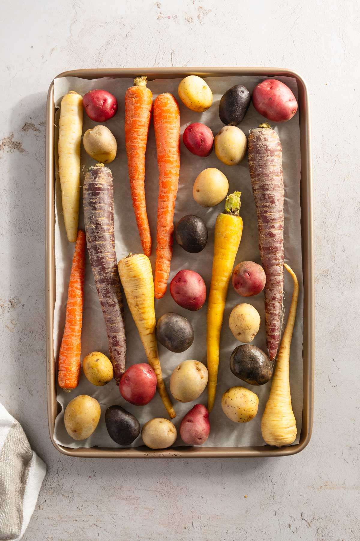 whole veggies on a baking sheet