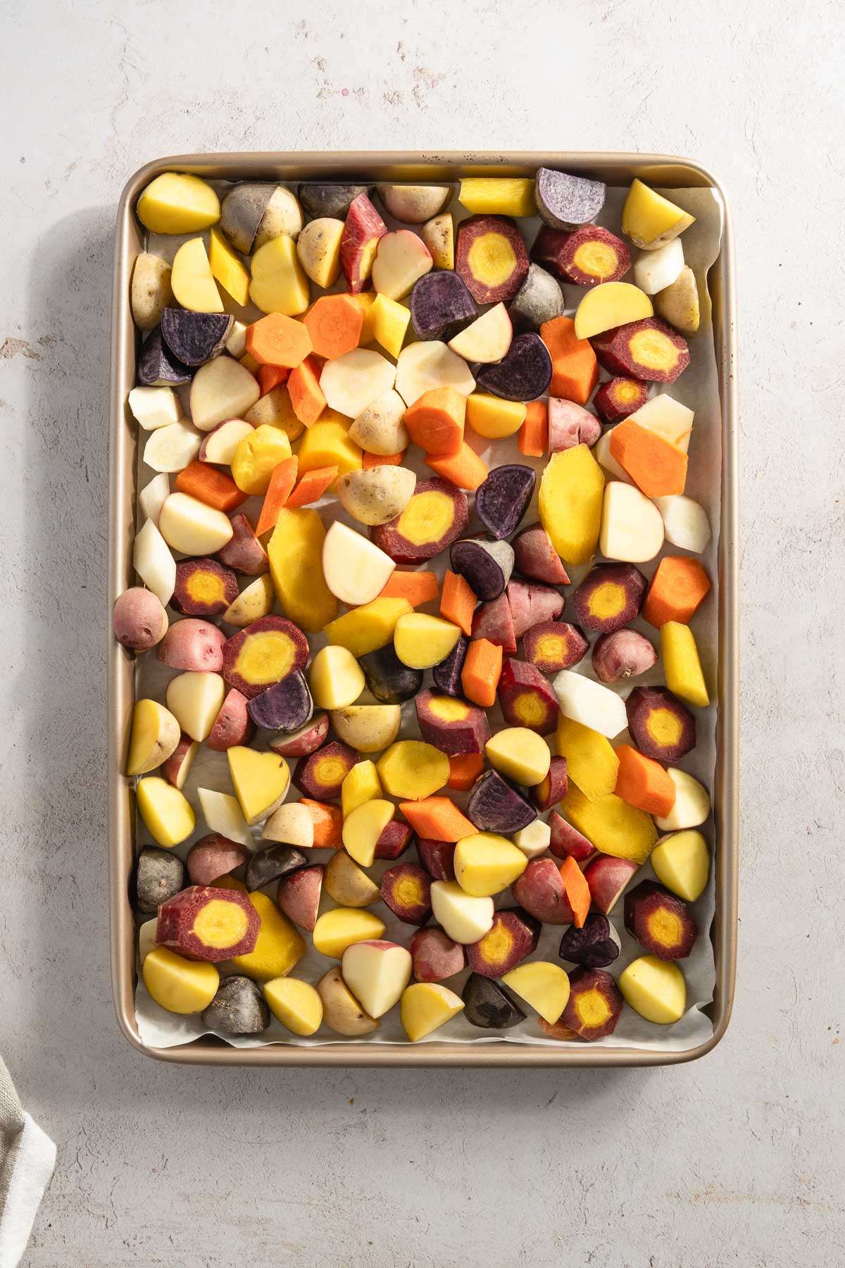 chopped veggies on a baking sheet