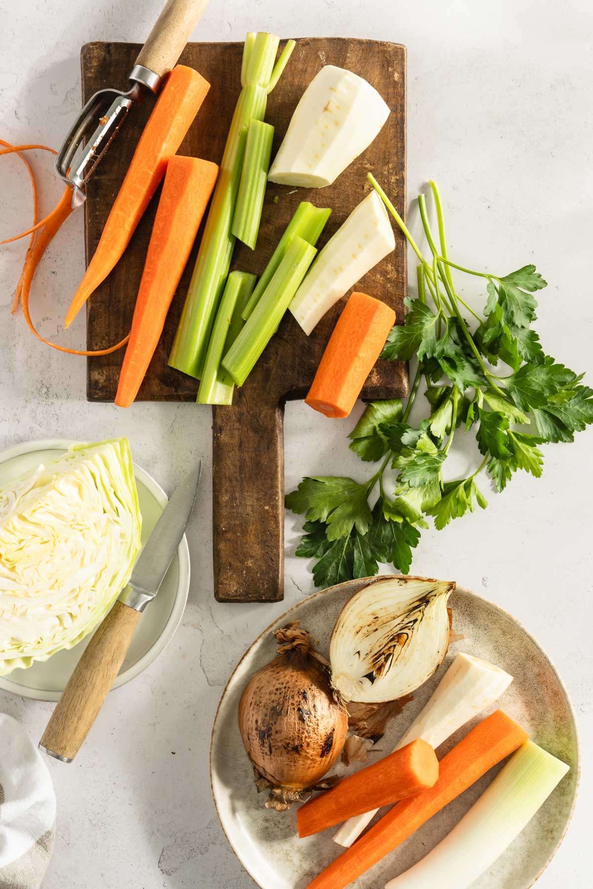 vegetables on a cutting board, some on the plate