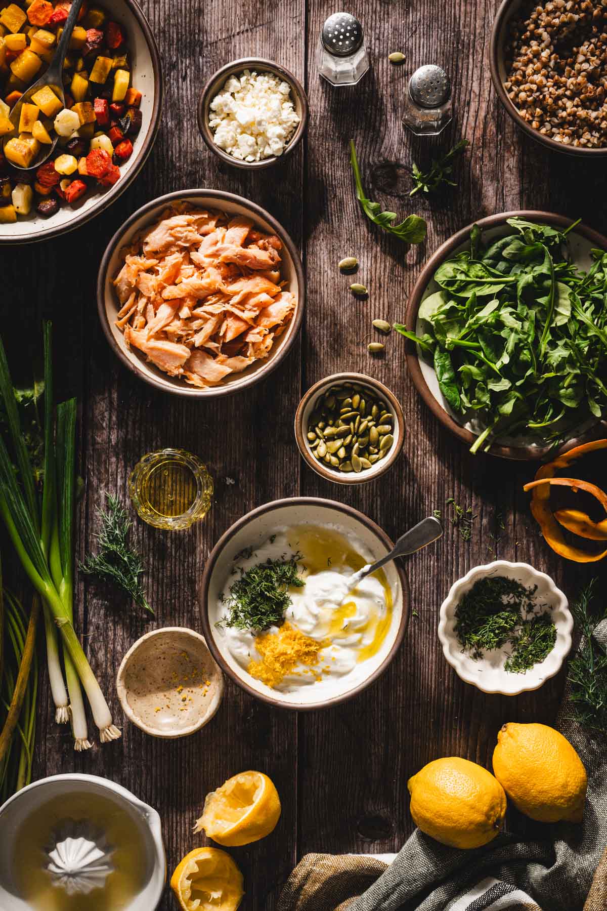 dill, lemon zest, juice added to a bowl with yogurt