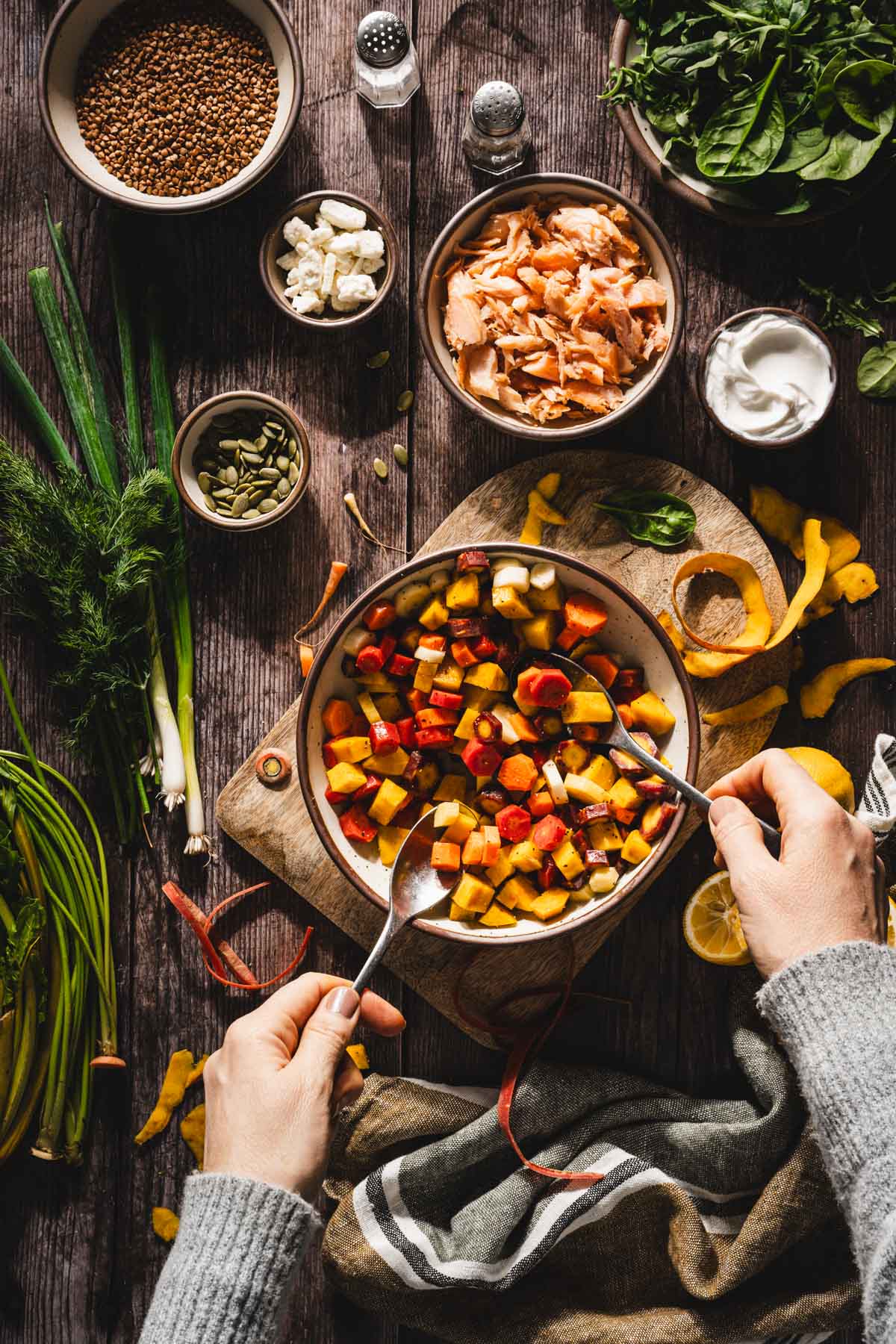 hands in frame mixing the veggies