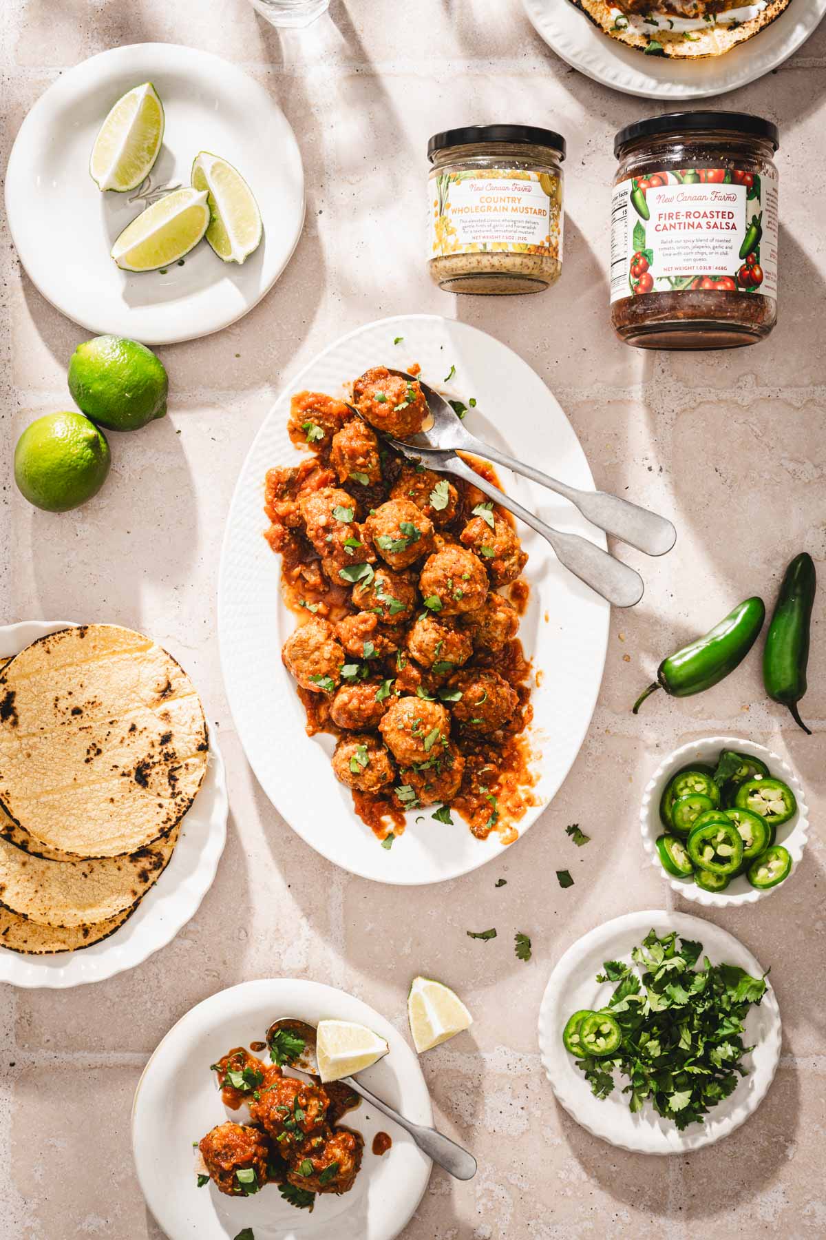 serving plate with meatballs, other small plates around