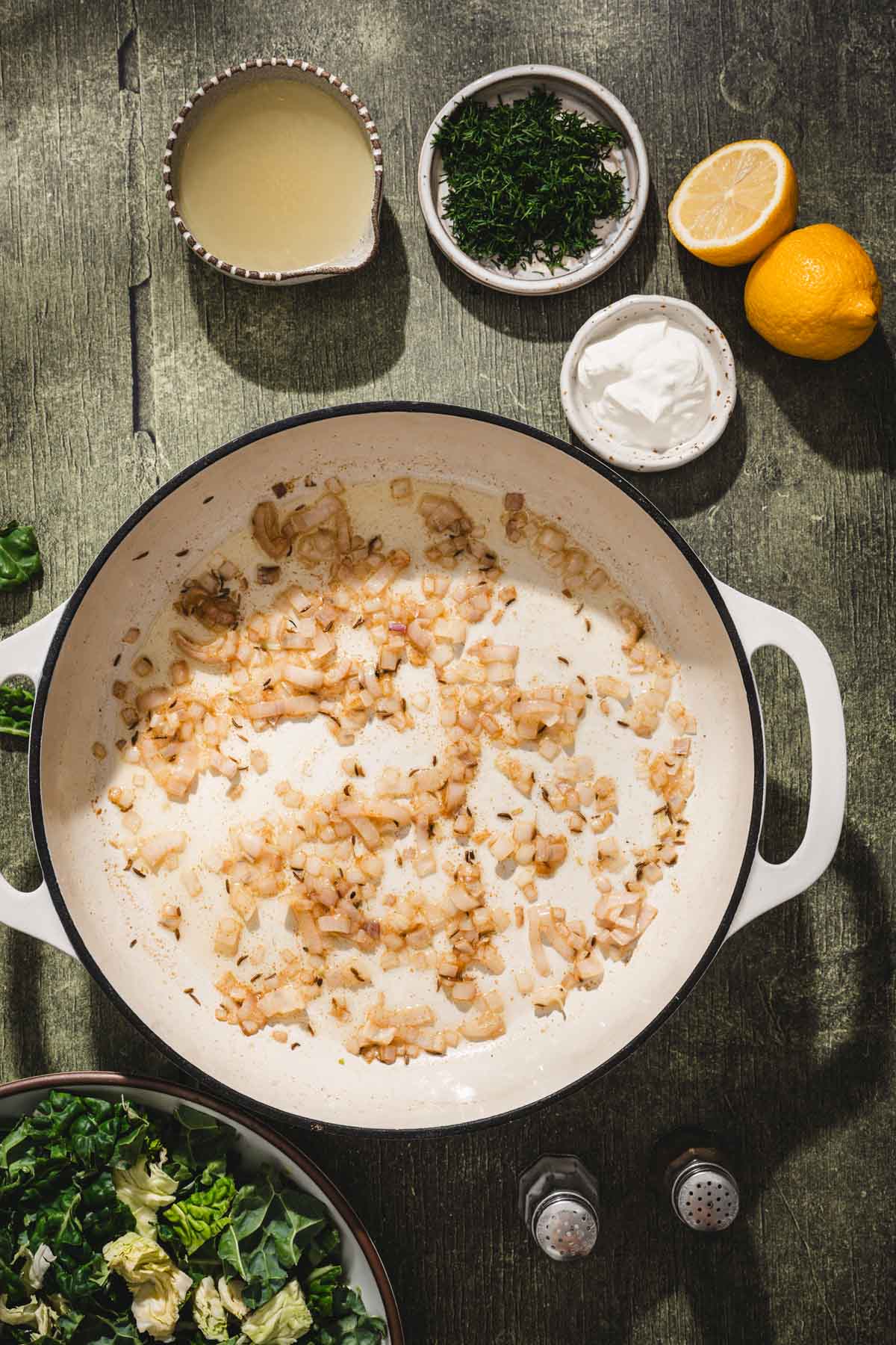 large skillet with shallots
