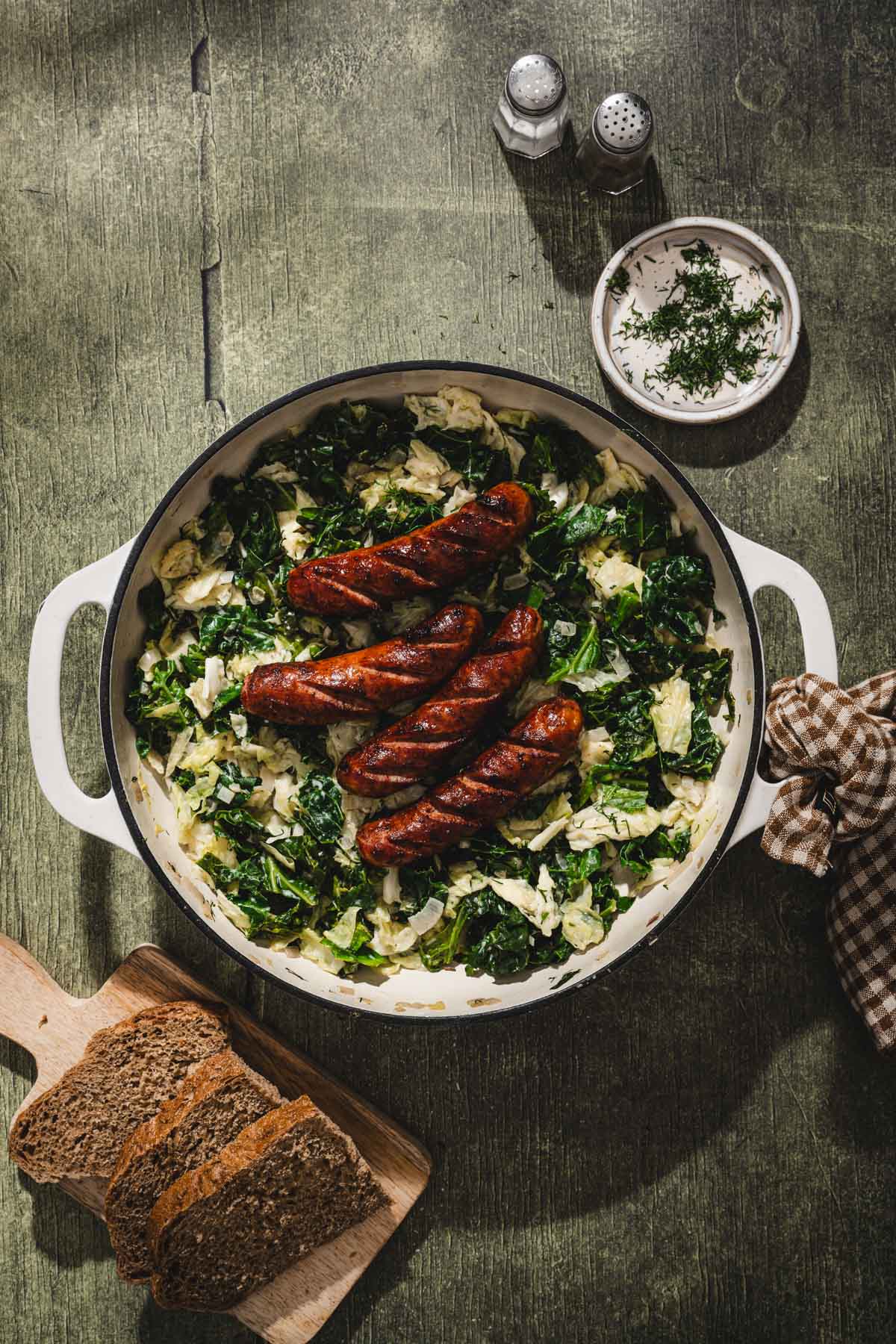 sausage added on top of the cooked cabbage