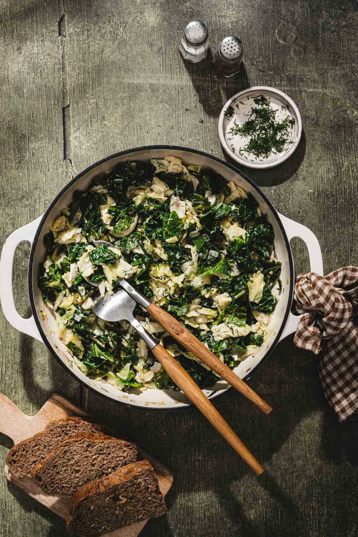 cooked cabbage, serving utensils