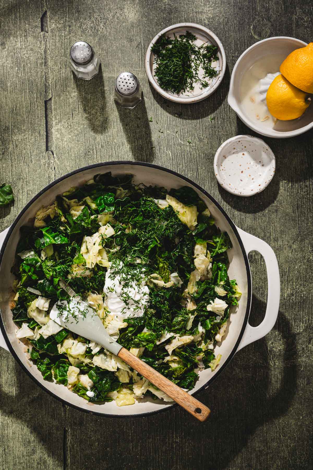 partially cooked cabbage in a skillet