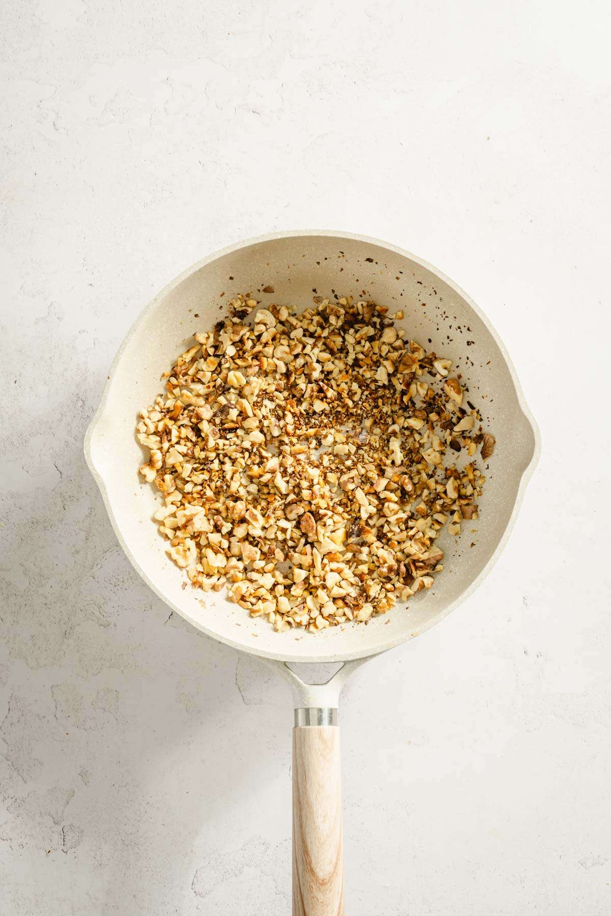 chopped walnuts on a frying pan, roasted