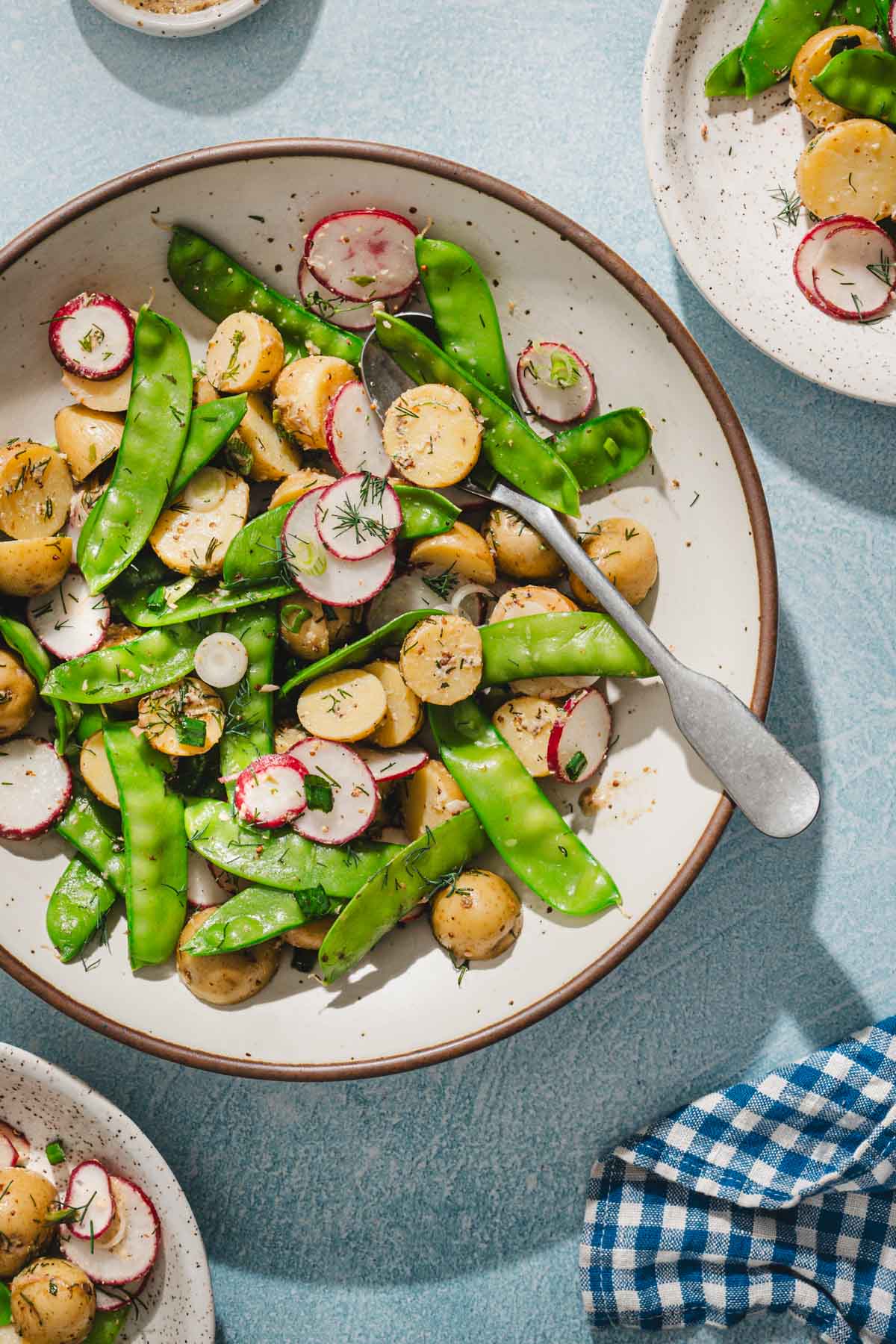 close up of a serving bowl with snow peas