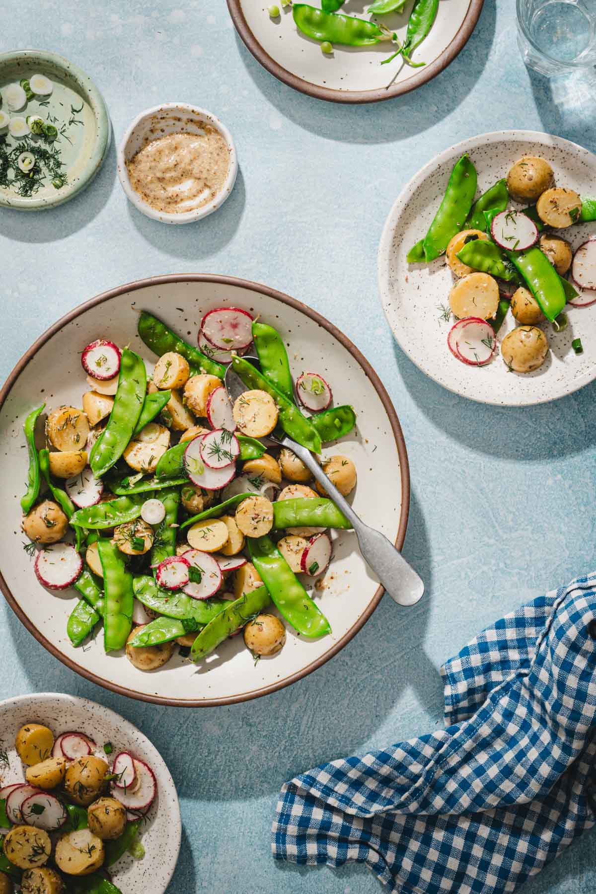 large serving bowl with snow peas, napkin